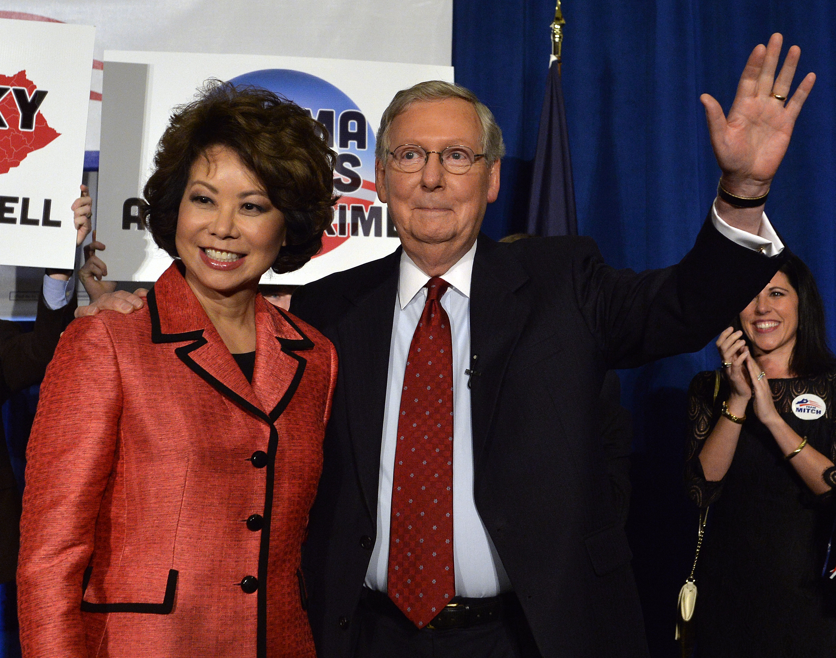Kentucky Senator Mitch McConnell, right, and his wife Elaine Chao wave to his supporters following his victory in the republican primary Tuesday, May 20, 2014, at the Mariott Louisville East in Louisville, Ky. (AP Photo/Timothy D. Easley) (AP)