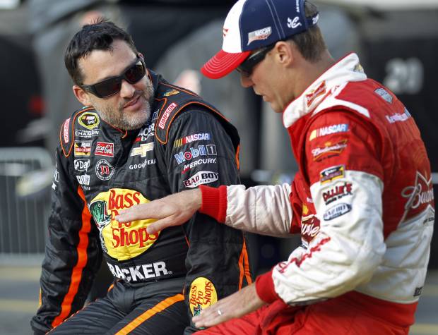 Tony Stewart, left, talks with Kevin Harvick (AP Photo/Terry Renna)