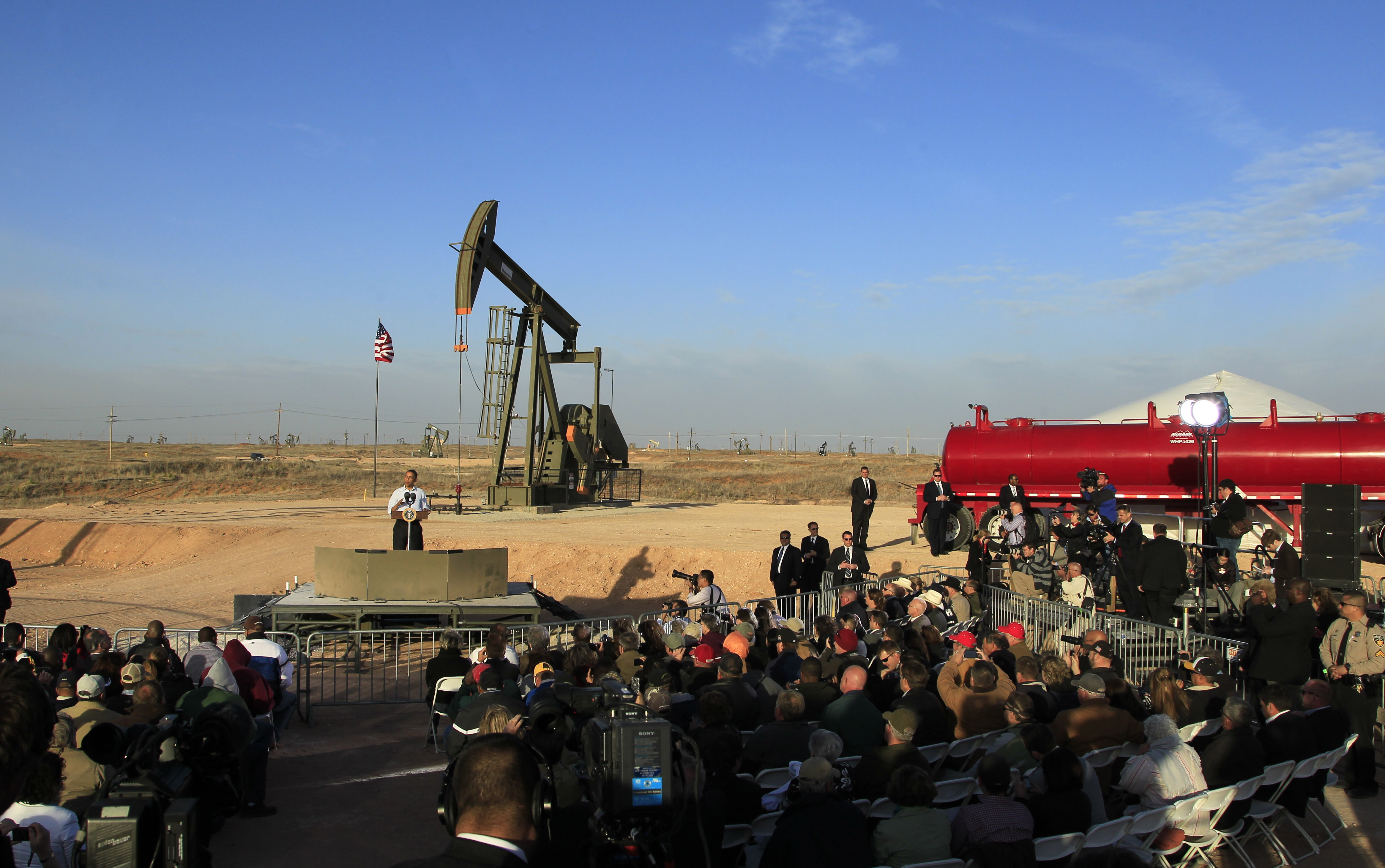 FILE - In this March 21, 2012, file photo, with oil pump jacks as a backdrop, President Barack Obama speaks at an oil and gas field on federal lands in Maljamar, N.M. The government has failed to inspect thousands of oil and gas wells it considers potentially high risks for water contamination and other environmental damage, congressional investigators say. The report, obtained by The Associated Press before its public release, highlights substantial gaps in oversight by the agency that manages oil and gas development on federal and Indian lands. (AP Photo/Ross D. Franklin, File) (AP)