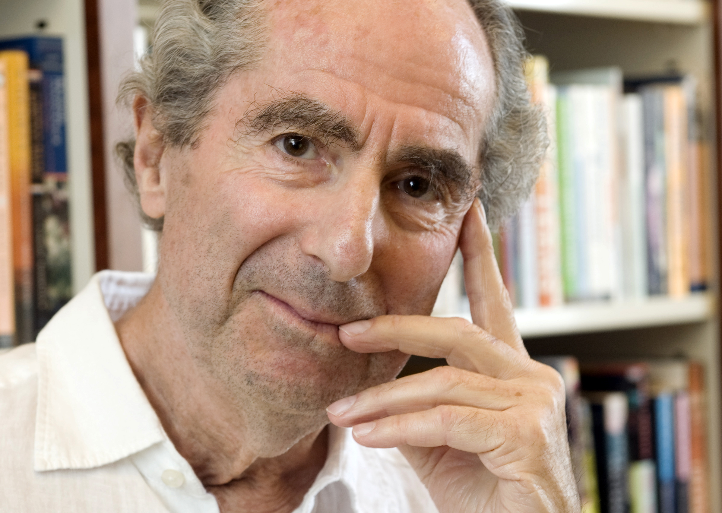 FILE - In this Sept. 8, 2008 file photo, author Philip Roth poses for a photo in the offices of his publisher Houghton Mifflin, in New York. (AP Photo/Richard Drew, file)