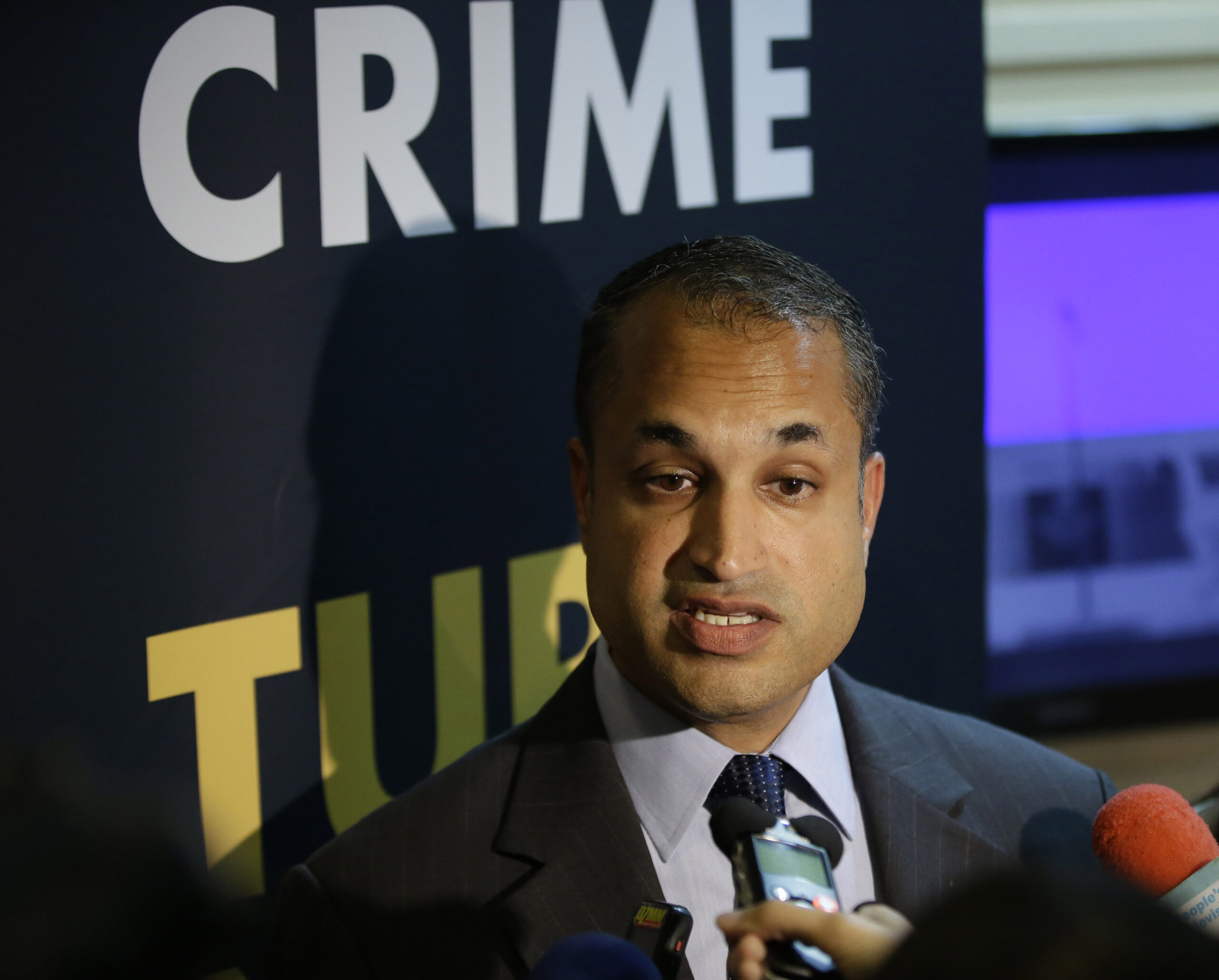 INTERPOL Digital Crime Centre Director Sanjay Virmani, is interviewed by reporters following a news conference Friday, May 2, 2014 at the Philippine National Police Headquarters at suburban Quezon city northeast of Manila, Philippines. Philippine police, backed by Interpol, have arrested dozens of suspected members of an online extortion syndicate who duped hundreds of victims worldwide into exposing themselves in front of webcams or engaging in lewd chats, including a Scottish teenager who committed suicide after being blackmailed, officials said.  (AP Photo/Bullit Marquez) (Bullit Marquez)