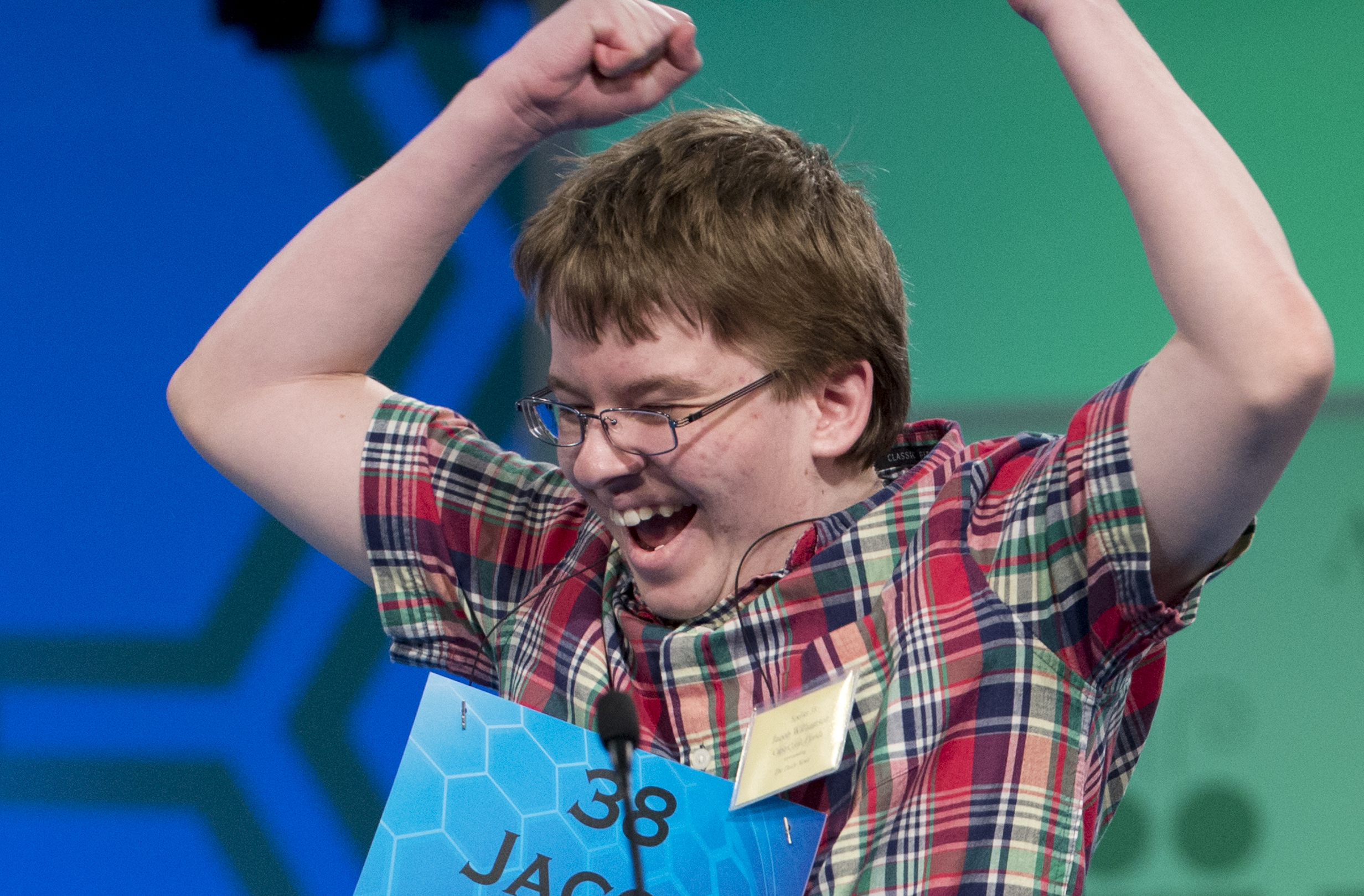 Eighth grade home-schooled pupil Jacob Williamson, 15, of Cape Coral, Fla., reacts after correctly spelling his word "harlequinade", during the semifinals of the Scripps National Spelling Bee, Thursday, May 29, 2014, at National Harbor in Oxon Hill, Md.   (AP Photo/Manuel Balce Ceneta)