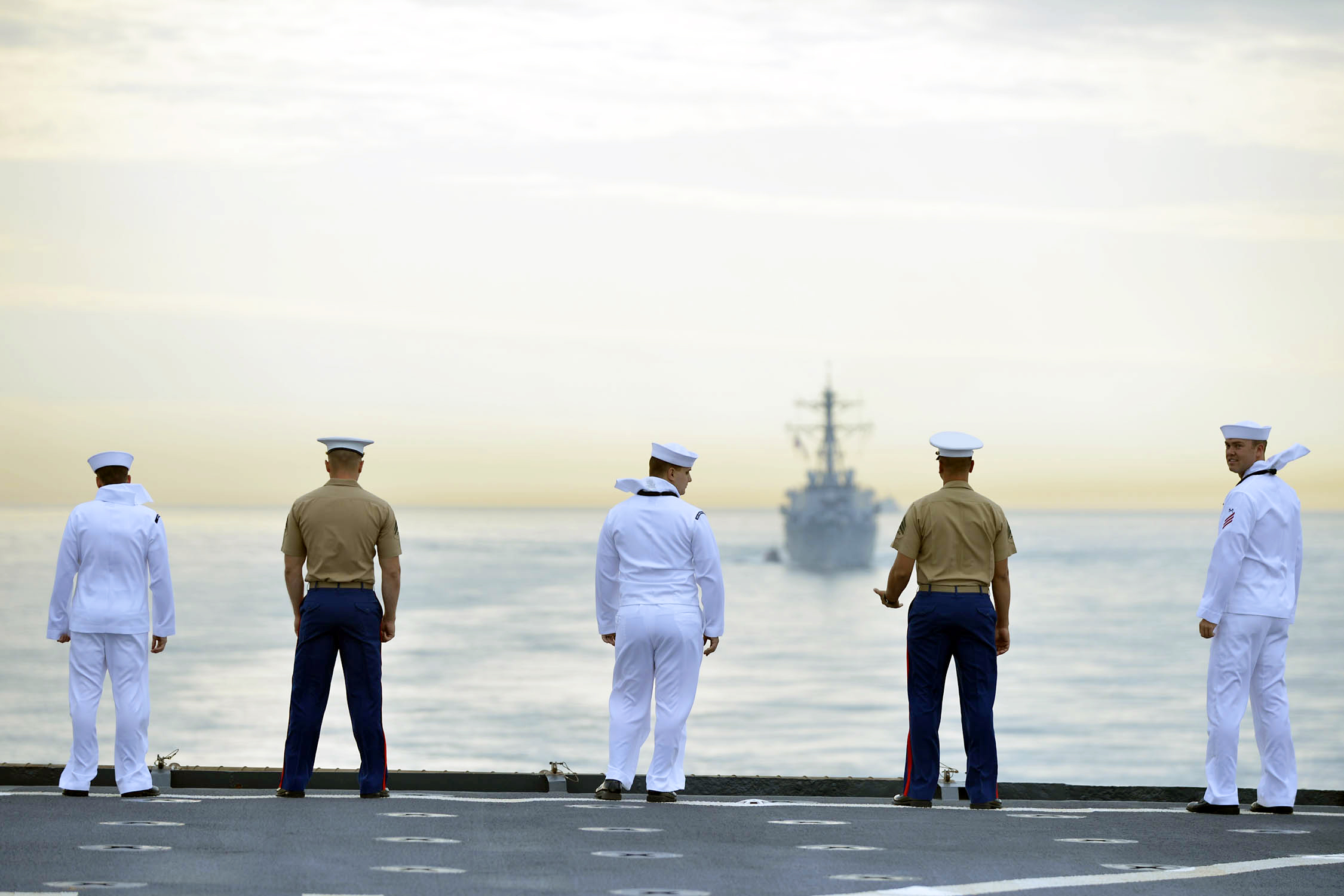 This photo released by TNT shows military personnel aboard the USS Oak Hill, en route to New York Harbor for Fleet Week celebrations on Wednesday, May 21, 2014. (AP)