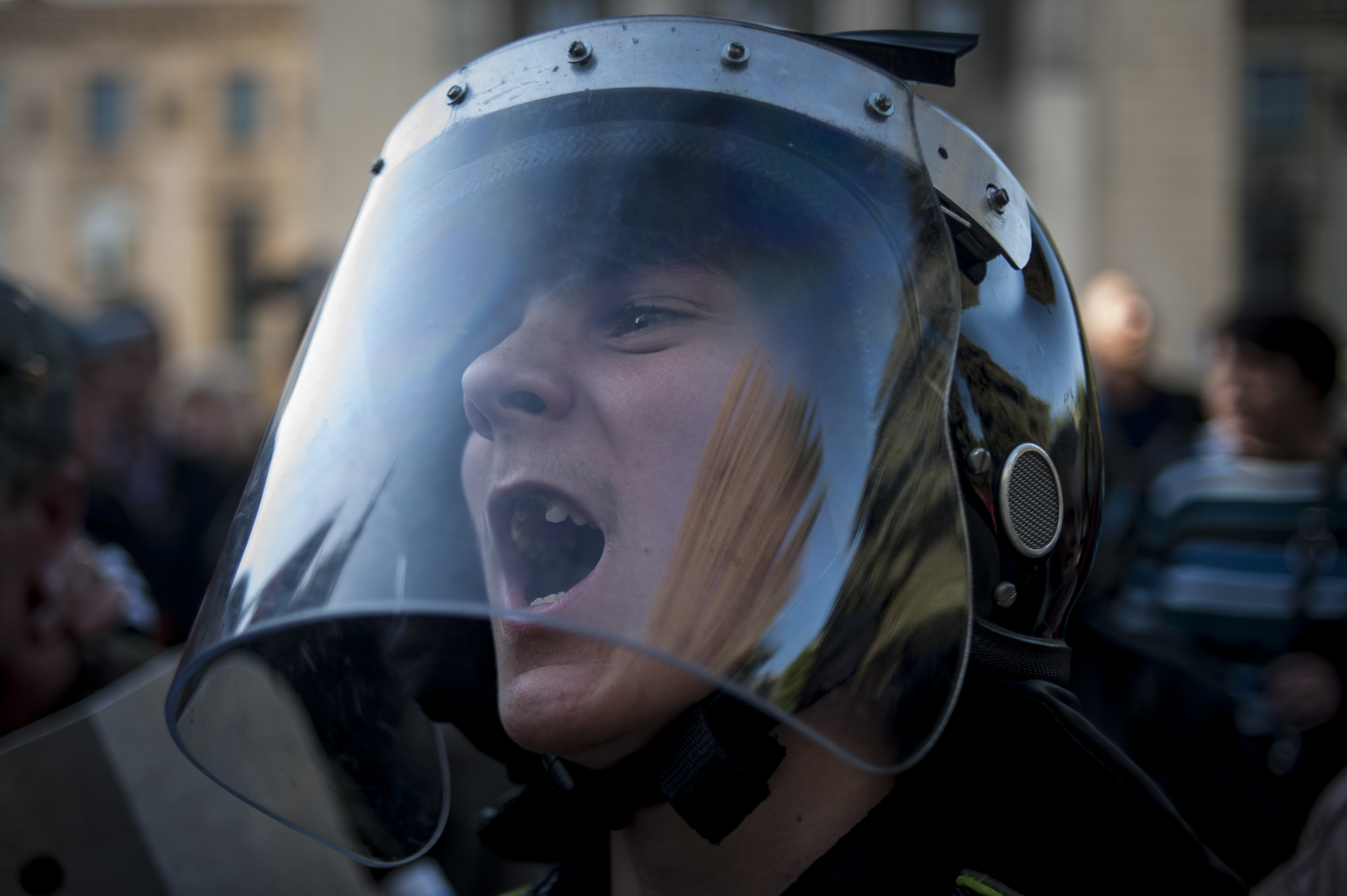 A pro-Russian activist wearing police helmet shouts outside the regional interior ministry building in Luhansk, eastern Ukraine, Wednesday, May 7, 2014. Eastern Ukraine has for weeks been swept by a wave of turbulent protests as opponents of the interim government in Kiev occupy official buildings and demand a referendum on autonomy for their regions. (AP Photo/Evgeniy Maloletka) (AP)