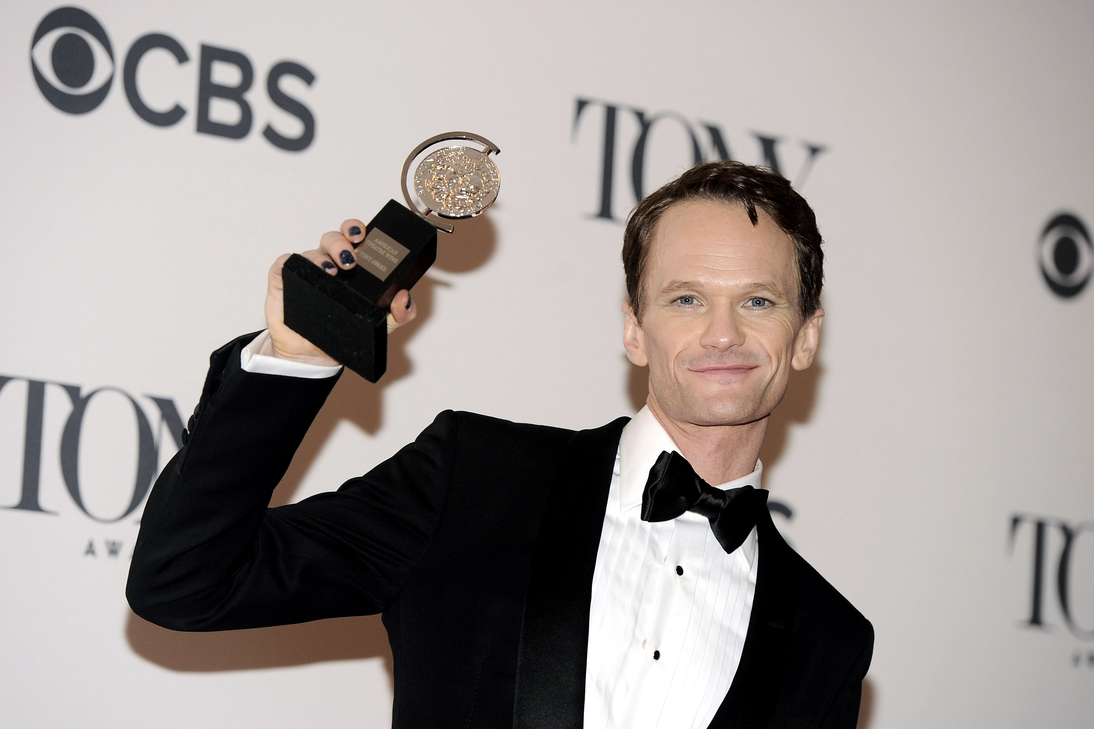 Neil Patrick Harris poses with his award for best performance by an actor in a leading role in a musical for his role in "Hedwig and The Angry Inch" in the press room at the 68th annual Tony Awards at Radio City Music Hall on Sunday, June 8, 2014, in New York. (Photo by Charles Sykes/Invision/AP) (Charles Sykes/Invision/AP)
