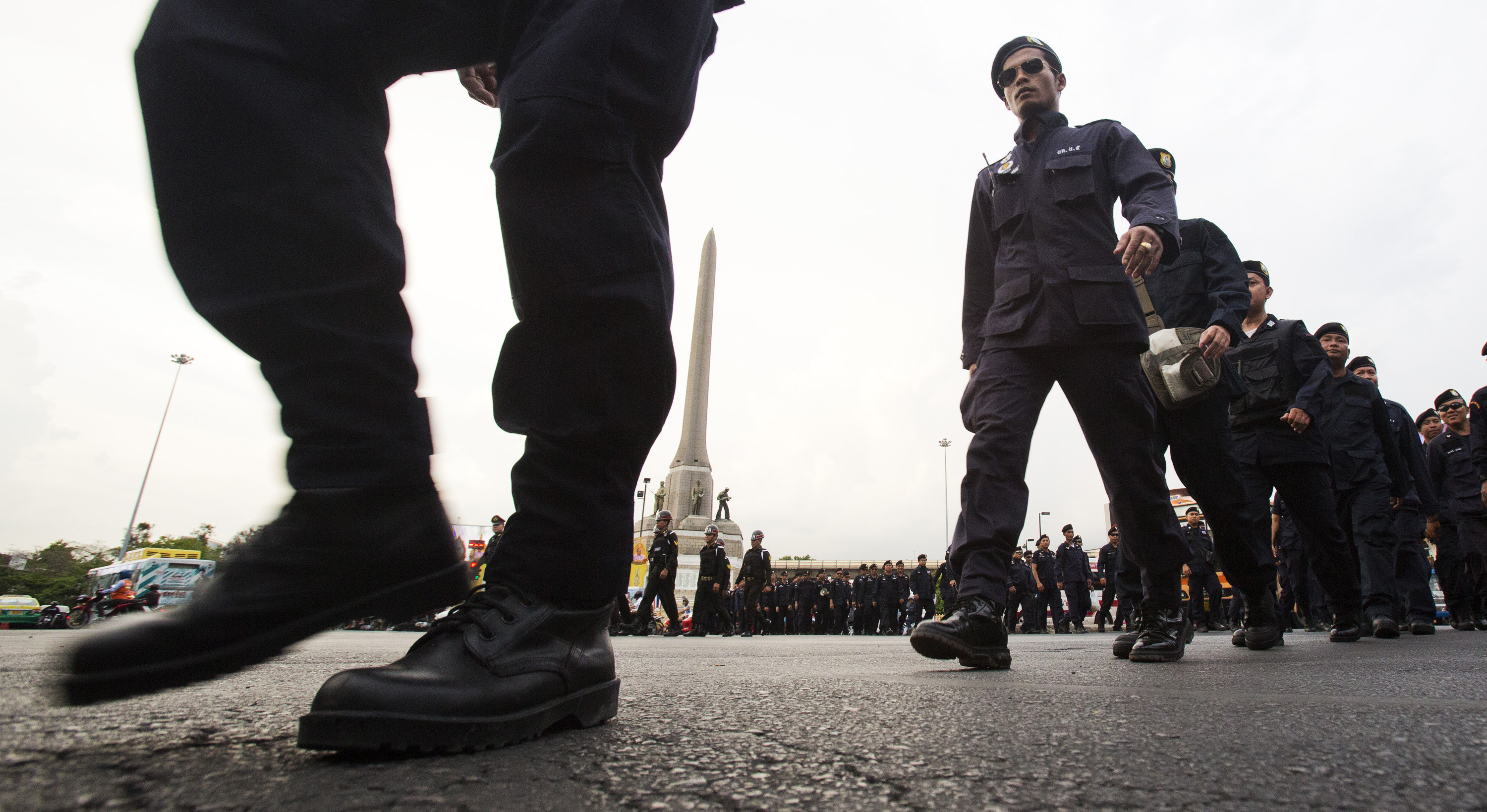 Thai police officers leave Victory Monument after they finish guarding inside it Tuesday, June 3, 2014 in Bangkok. (AP/Sakchai Lalit)