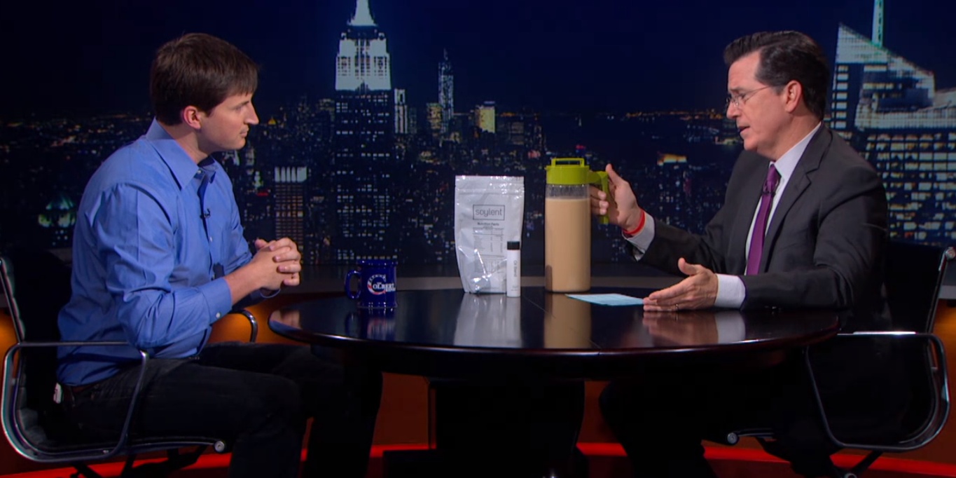 Rob Rhinehart and Stephen Colbert with Soylent (screenshot)