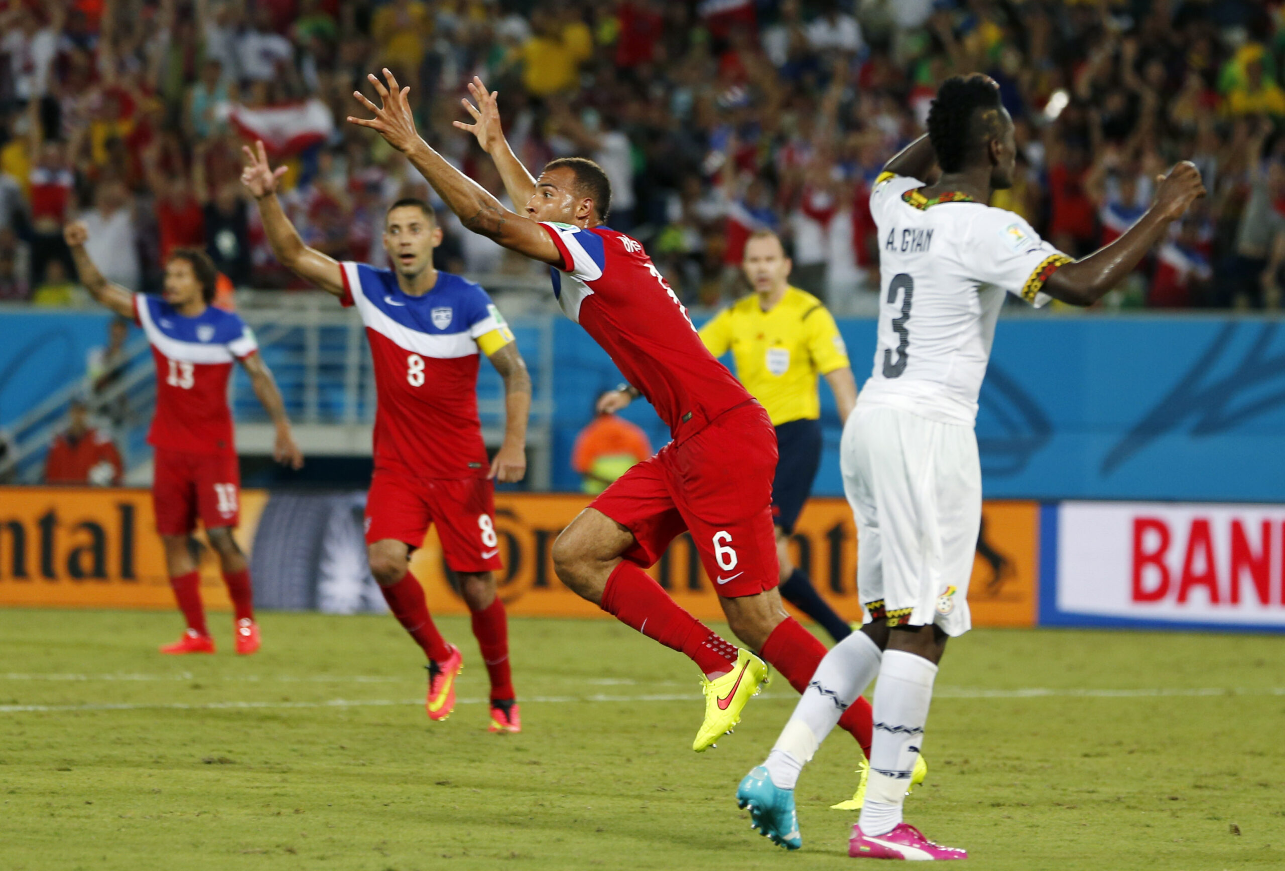United States' John Brooks (6) celebrates with teammates after scoring his side's second goal during the group G World Cup soccer match between Ghana and the United States at the Arena das Dunas in Natal, Brazil, Monday, June 16, 2014. (AP Photo/Julio Cortez) (Julio Cortez)