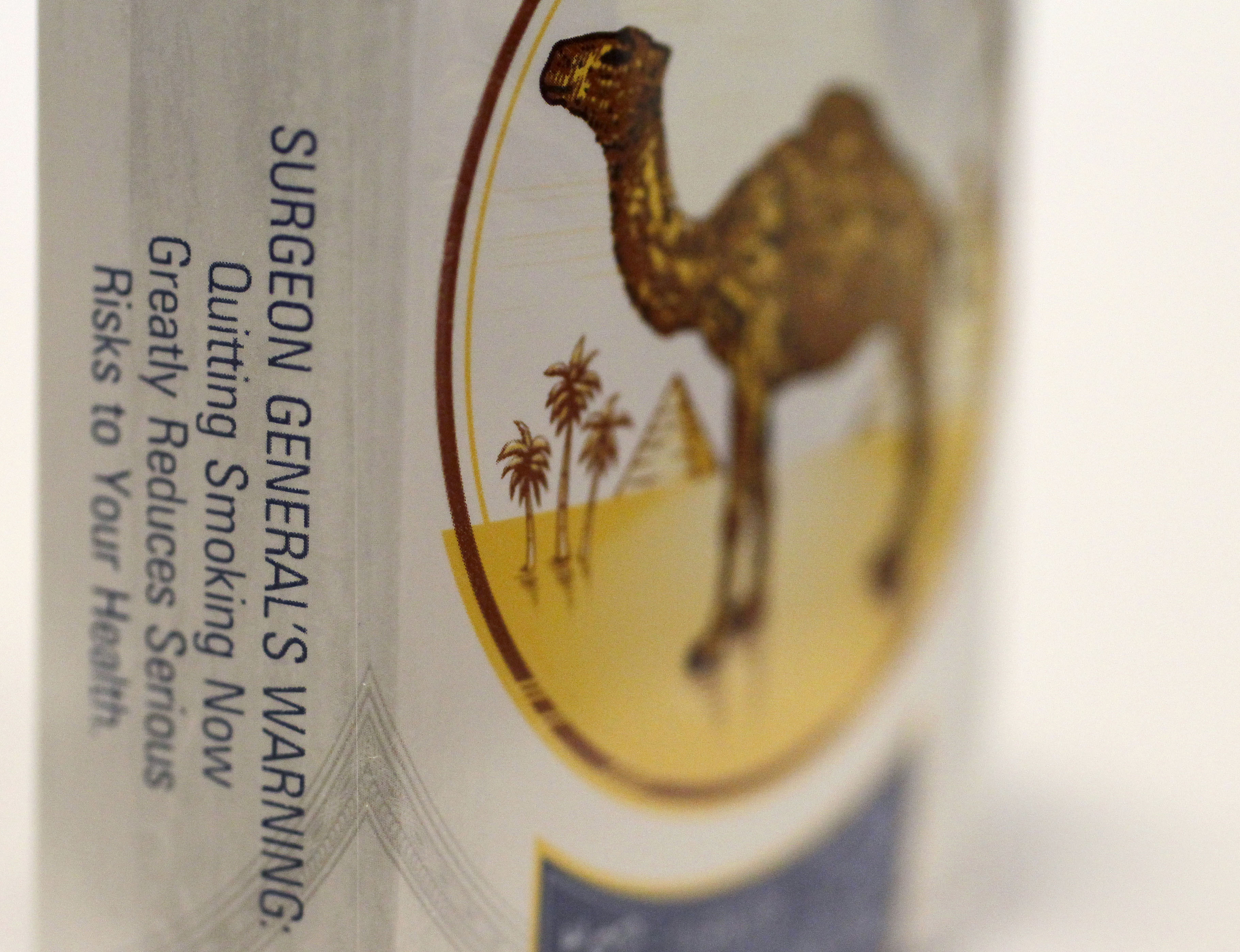FILE - In this Nov. 30, 2012 file photo, the Surgeon General's Warning appears on a pack of Camel cigarettes purchased at a Chicago area news stand. (AP/Charles Rex Arbogast)