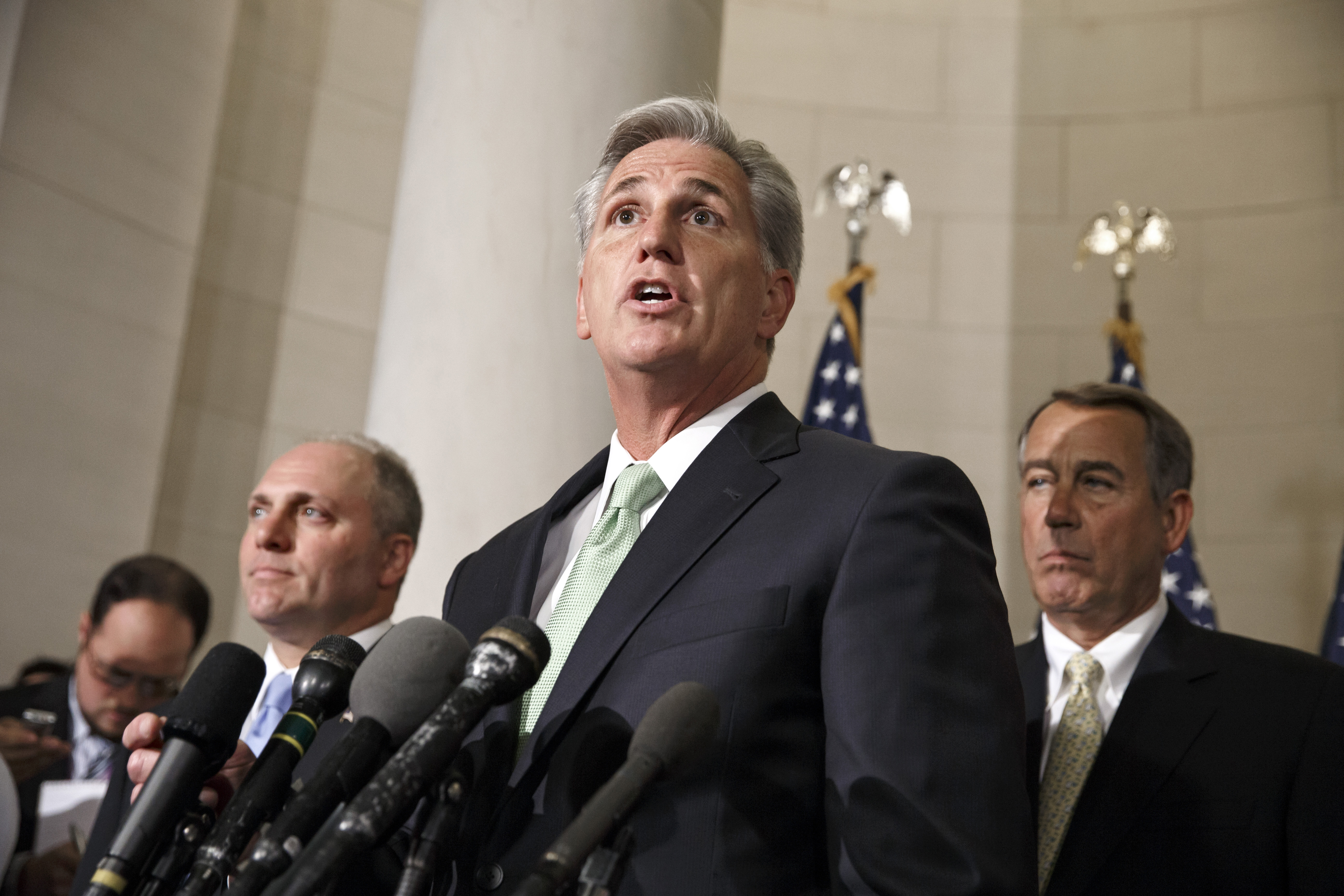 FILE - This June 19, 2014 file photo shows House Majority Whip Kevin McCarthy, R-Calif., with Rep. Steve Scalise, R-La., left, and Speaker of the House John Boehner, R-Ohio, right, on Capitol Hill in Washington just after McCarthy was voted new majority leader, replacing Rep. Eric Cantor, R-Va., who was defeated in the primary election. This year, Congress logged a confidence rating of 7 percent, the lowest Gallup has measured for any institution, ever. People talk about throwing the bums out, but voters keep sending the same bunch back in. This November, when Republicans and Democrats face off in what looks to be a dramatic midterm election, the vast majority of current lawmakers are sitting snugly in their seats. (AP Photo/J. Scott Applewhite, File) (AP)