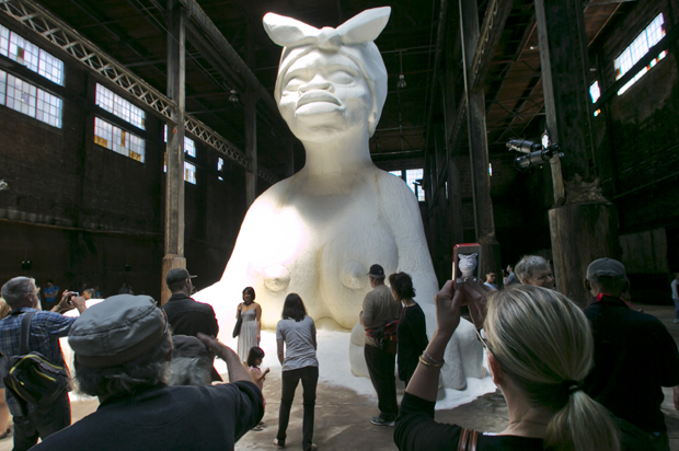 "A Subtlety or the Marvelous Sugar Baby," by artist Kara Walker, on display inside the former Domino Sugar Refinery, Brooklyn, NY. (AP/Richard Drew)