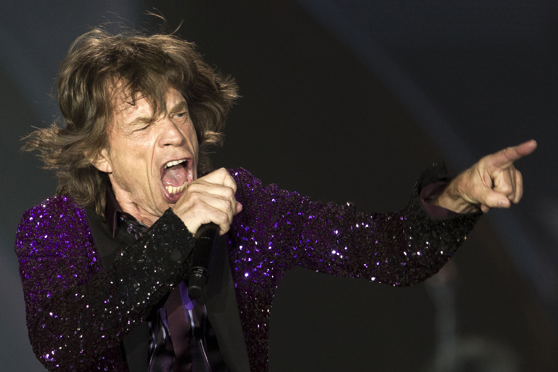 FILE - In this June 4, 2014 file photo, Rolling Stones singer Mick Jagger performs during a concert in Hayrkon Park in Tel Aviv, Israel. (AP/Ariel Schalit)
