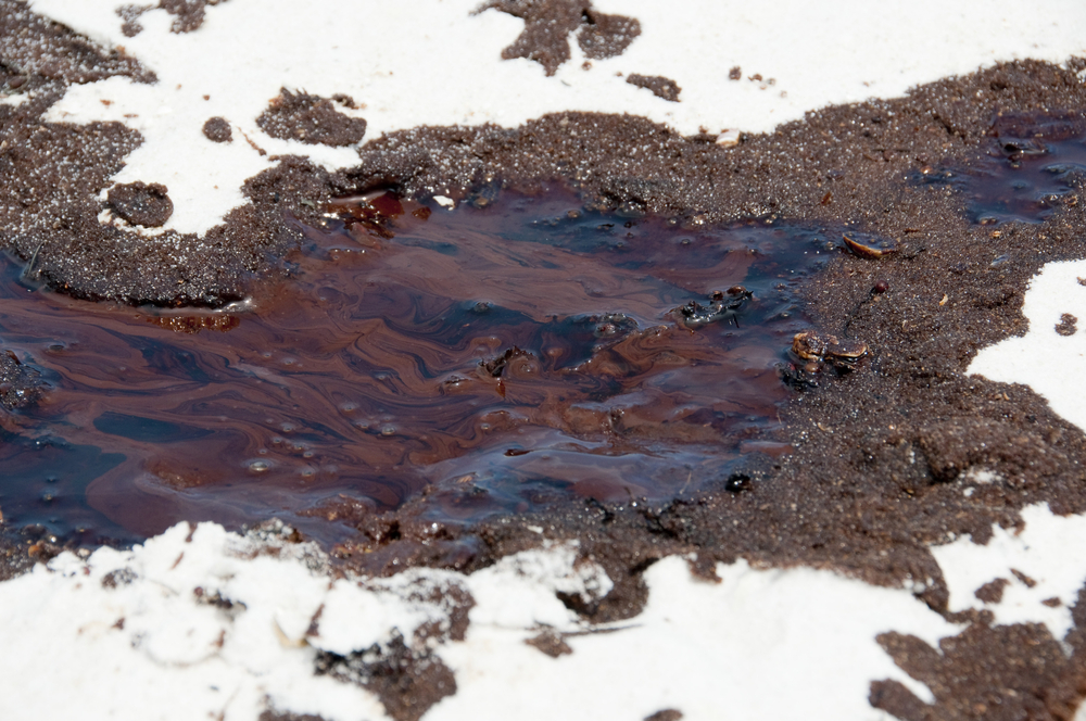 Oil covered sand is shown on June 23, 2010 in Pensacola Beach, FL. (Cheryl Casey/Shutterstock)