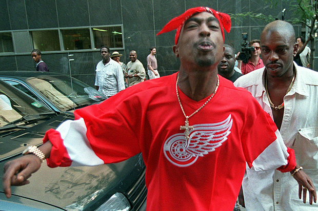Tupac Shakur spits in the direction of reporters as he leaves state Supreme Court in New York, July 5, 1994. (AP/Bebeto Matthews)