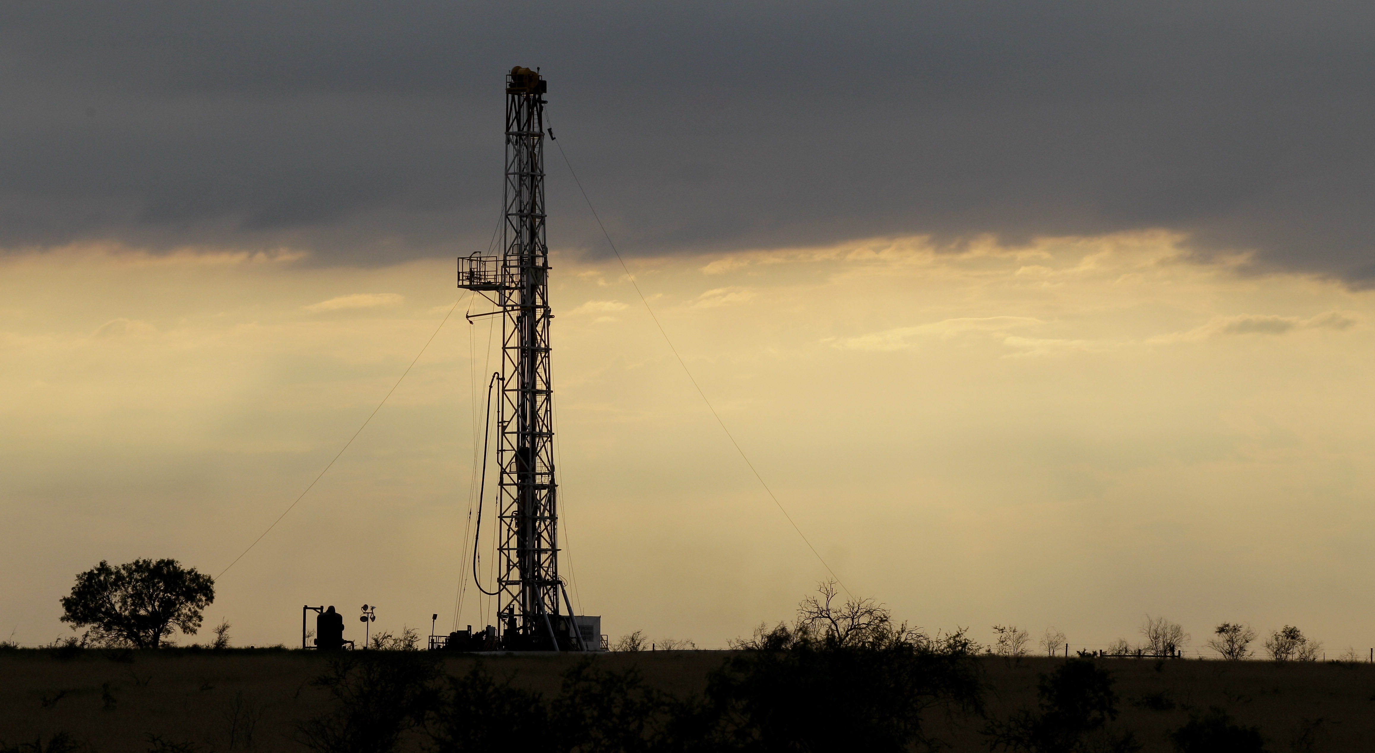 FILE - This May 9, 2012 file photo shows a drilling rig near Kennedy, Texas. Oil companies are finding new ways to export growing amounts of oil from the U.S. despite restrictions on exporting crude.(AP Photo/Eric Gay, File) (AP)