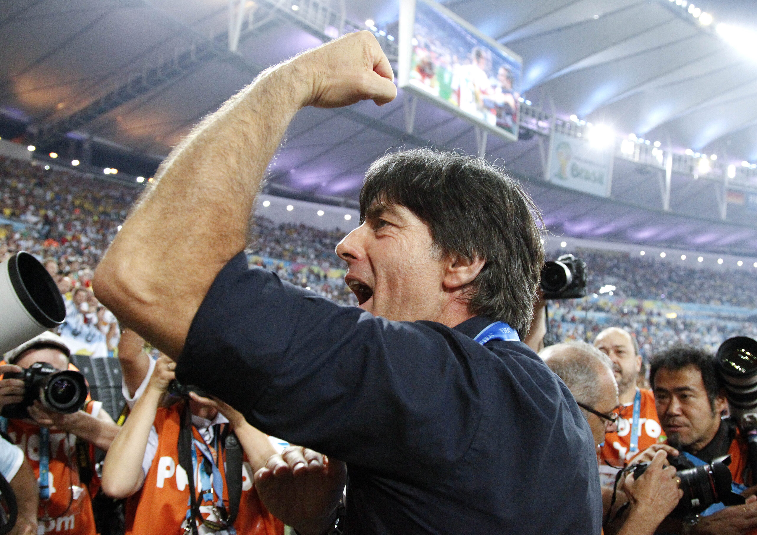 Germany's head coach Joachim Loew acknowledges the cheers during a victory lap after the World Cup final soccer match between Germany and Argentina at the Maracana Stadium in Rio de Janeiro, Brazil, Sunday, July 13, 2014. Germany won the match 1-0. (AP Photo/Matthias Schrader) (Matthias Schrader)