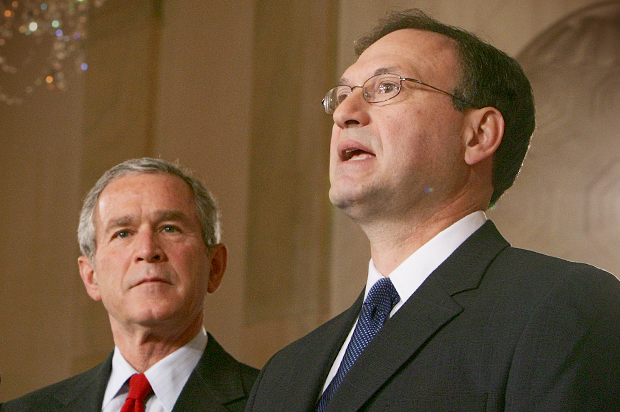 President Bush watches Judge Samuel Alito speak after he announced Alito's selection as his new nominee for the Supreme Court, Monday, Oct. 31, 2005. (AP/Ron Edmonds)