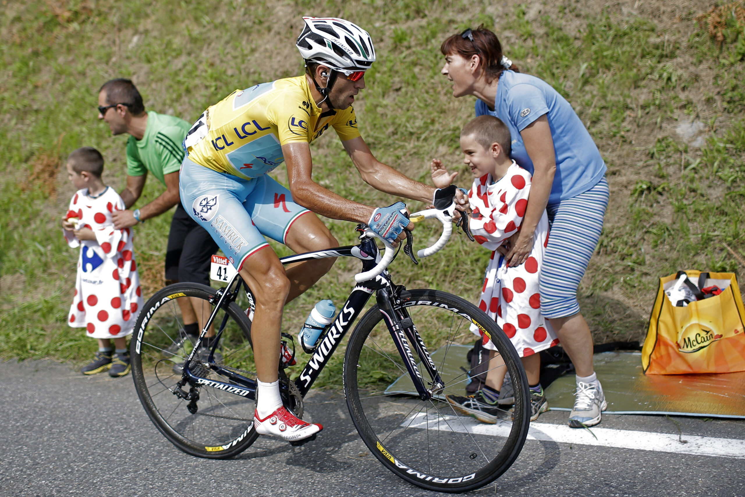 Italy's Vincenzo Nibali, wearing the overall leader's yellow jersey, climbs towards Hautacam to win the eighteenth stage of the Tour de France cycling race over 145.5 kilometers (90.4 miles) with start in Pau and finish in Hautacam, Pyrenees region, France, Thursday, July 24, 2014. (AP Photo/Laurent Cipriani) (Laurent Cipriani)
