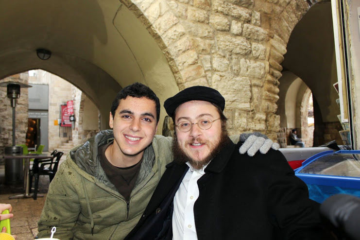 This 2012 photo provided by Rabbi Asher Hecht, shows Nissim Sean Carmeli, left, with Hecht in Jerusalem. The Israel Defense Forces said Sunday, July 20, 2014, in a statement that Carmeli was killed in combat in the Gaza Strip. Carmeli was from South Padre Island, Texas, said Deputy Consul General of Israel to the Southwest Maya Kadosh. (AP Photo/Rabbi Asher Hecht via Chabad of the Rio Grande Valley) (AP)