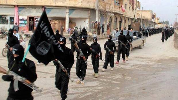 Fighters from the al-Qaida linked Islamic State of Iraq and the Levant (ISIL) marching in Raqqa, Syria (AP Photo/Militant Website)