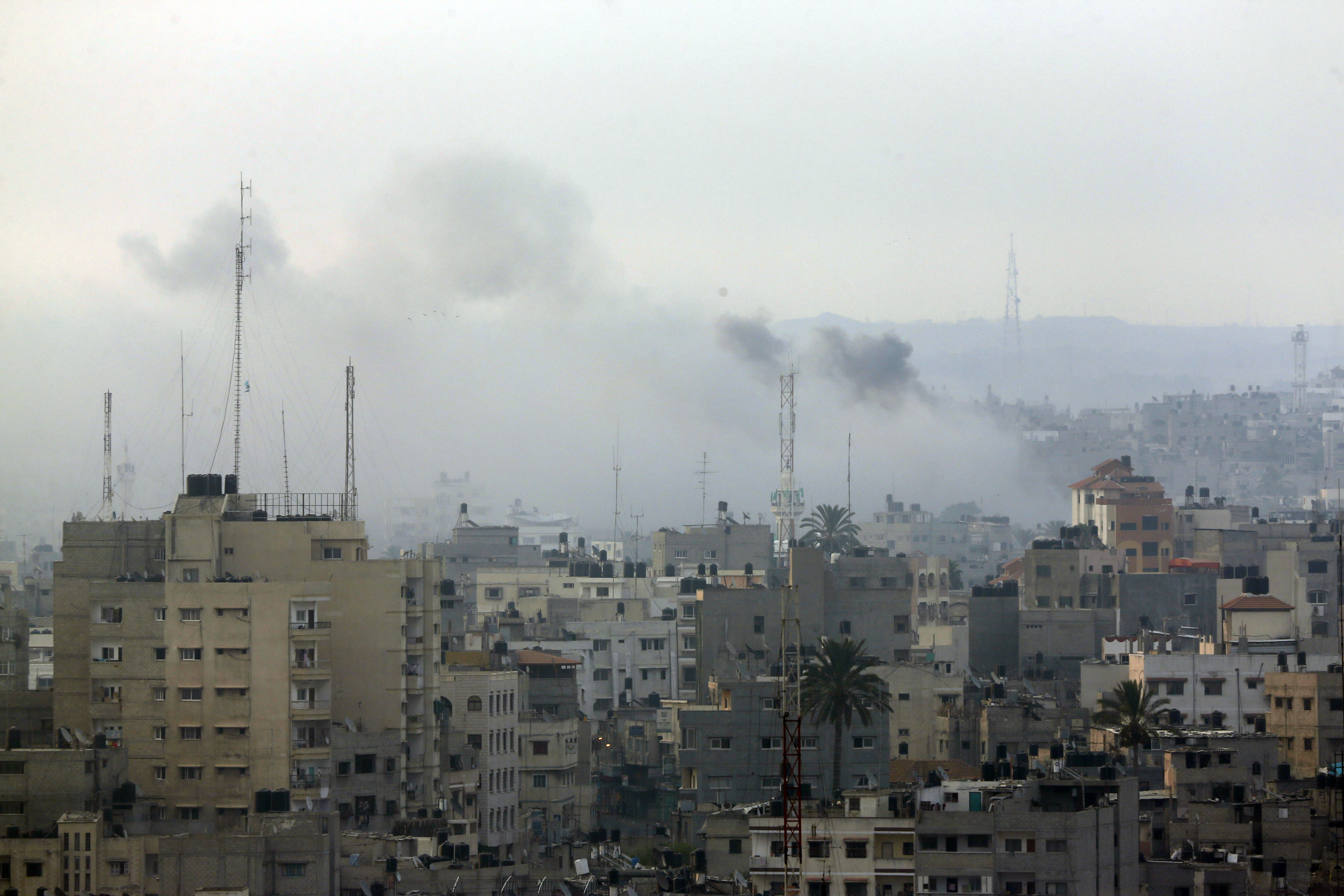 Smoke from Israeli strikes rises over Gaza City , northern Gaza Strip, Sunday, July 20, 2014. Israel said it widened its ground offensive early Sunday, sending more troops into Gaza after demolishing more than a dozen Hamas tunnels and intensifying tank fire on border areas. Since the start of Israel-Hamas fighting almost two weeks ago, over 300 Palestinians were killed and 2,700 wounded in Israeli air and artillery strikes, according to Palestinian health officials. One-fourth of the deaths were reported since the start of the ground offensive late Thursday, the officials said.(AP Photo/Lefteris Pitarakis) (AP)