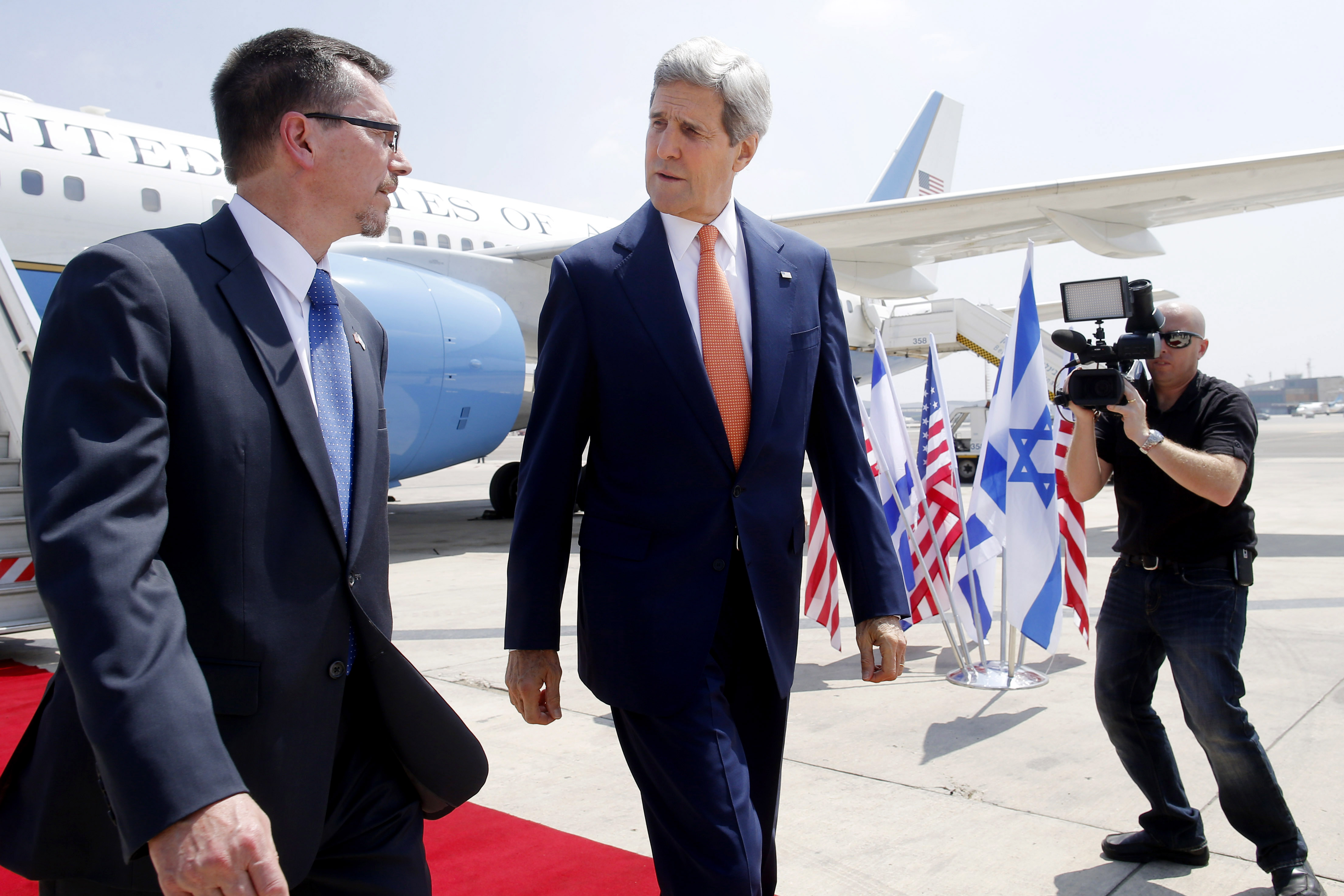 U.S. Secretary of State John Kerry walks with U.S. Embassy Deputy Chief of Mission Bill Grant as he arrives to Tel Aviv, Israel, Wednesday, July 23, 2014. Kerry is meeting with U.N. Secretary-General Ban Ki-moon, Israeli Prime Minister Benjamin Netanyahu, and Palestinian Authority President Mahmoud Abbas as efforts for a cease-fire between Hamas and Israel continues. (AP Photo/Pool) (AP)