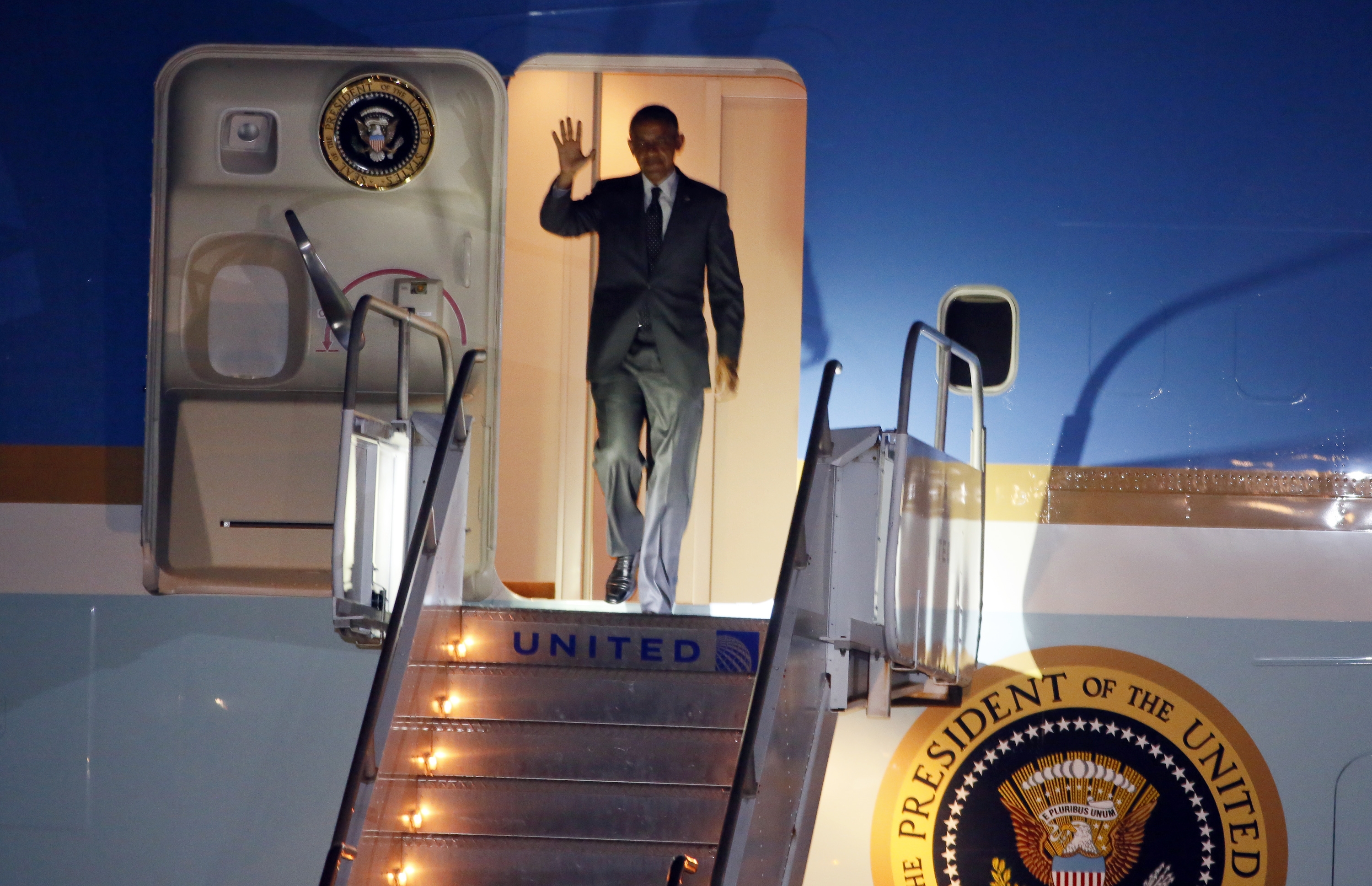 President Barack Obama waves as he exits Air Force One on arrival to Austin-Bergstrom International Airport on Wednesday, July 9, 2014, in Austin, Texas. Obama is spending the night in the Texas capital and on Thursday he will make a speech on the economy. (AP Photo/Jack Plunkett) (AP)