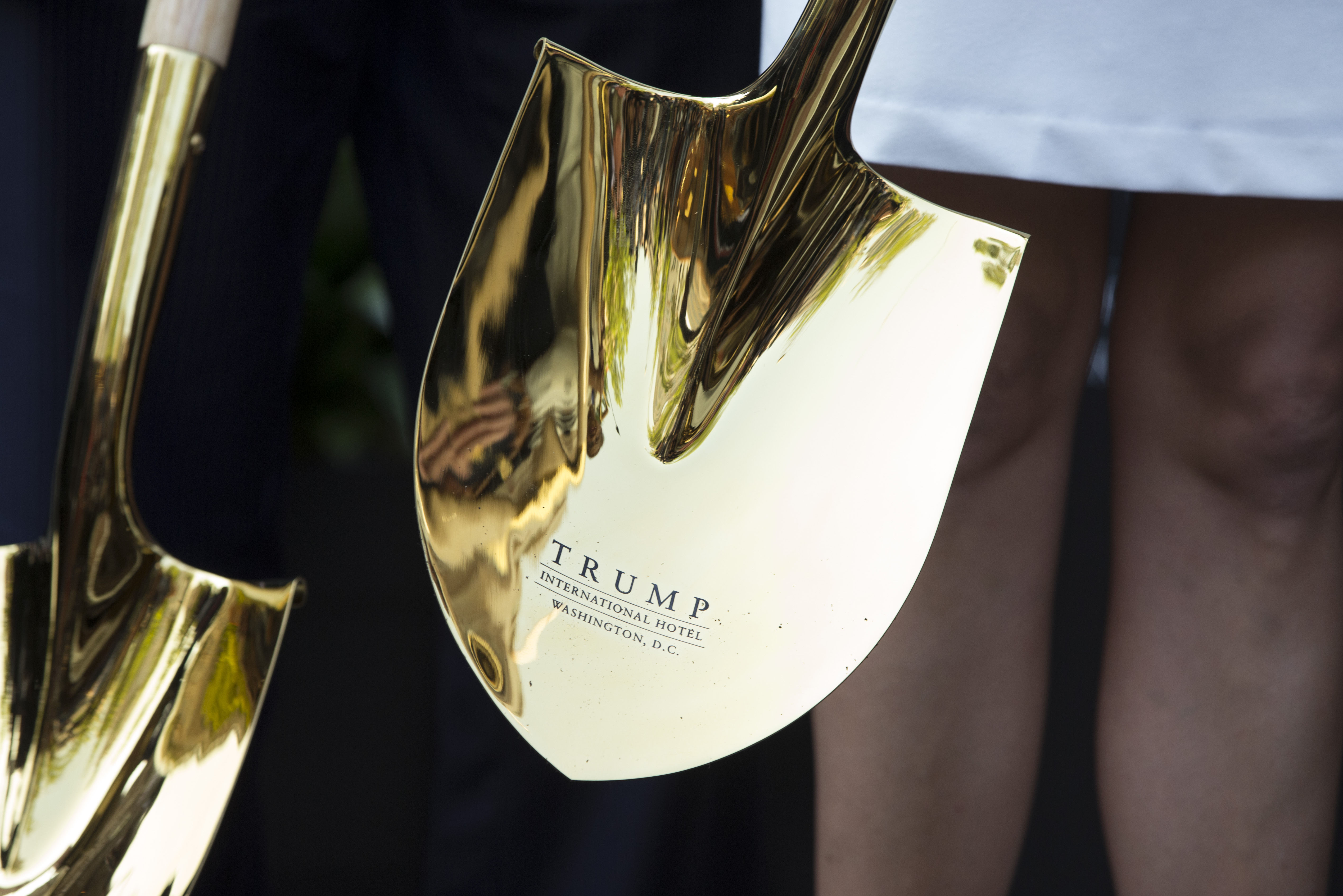 A shovel with the Tump logo is sheen during a ground breaking ceremony for the Trump International Hotel on the site of the Old Post Office in Washington, Wednesday, July 23, 2014. (AP)