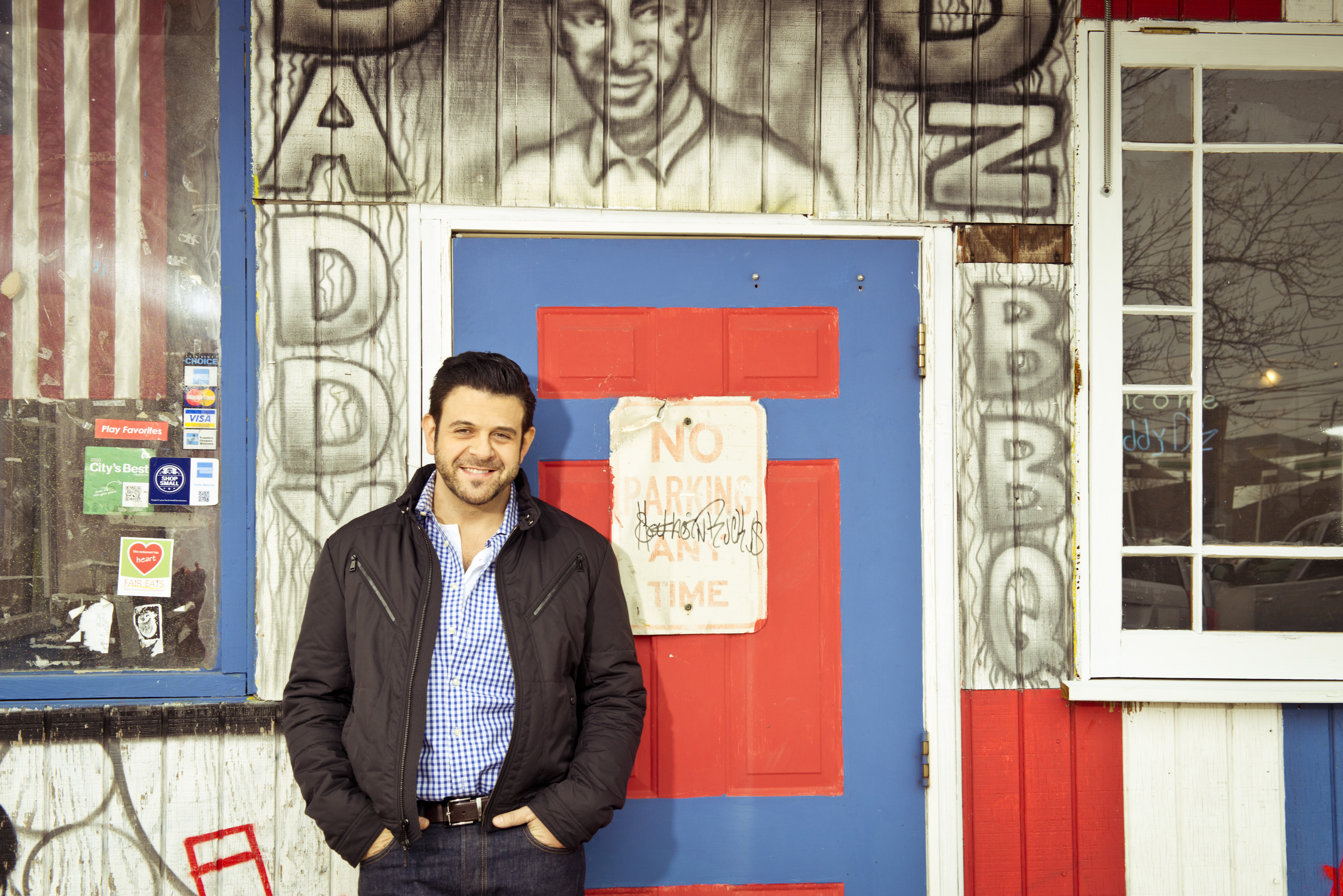 This undated photo provided by the Travel Channel shows host Adam Richman of the new series, "Man Finds Food" in Atlanta.  The channel said Tuesday, July 1, 2014, that Richman's show has been postponed indefinitely but didn't explain why. "Man Finds Food" was to debut Wednesday. (AP Photo/Travel Channel, Gabriela Herman) (AP)