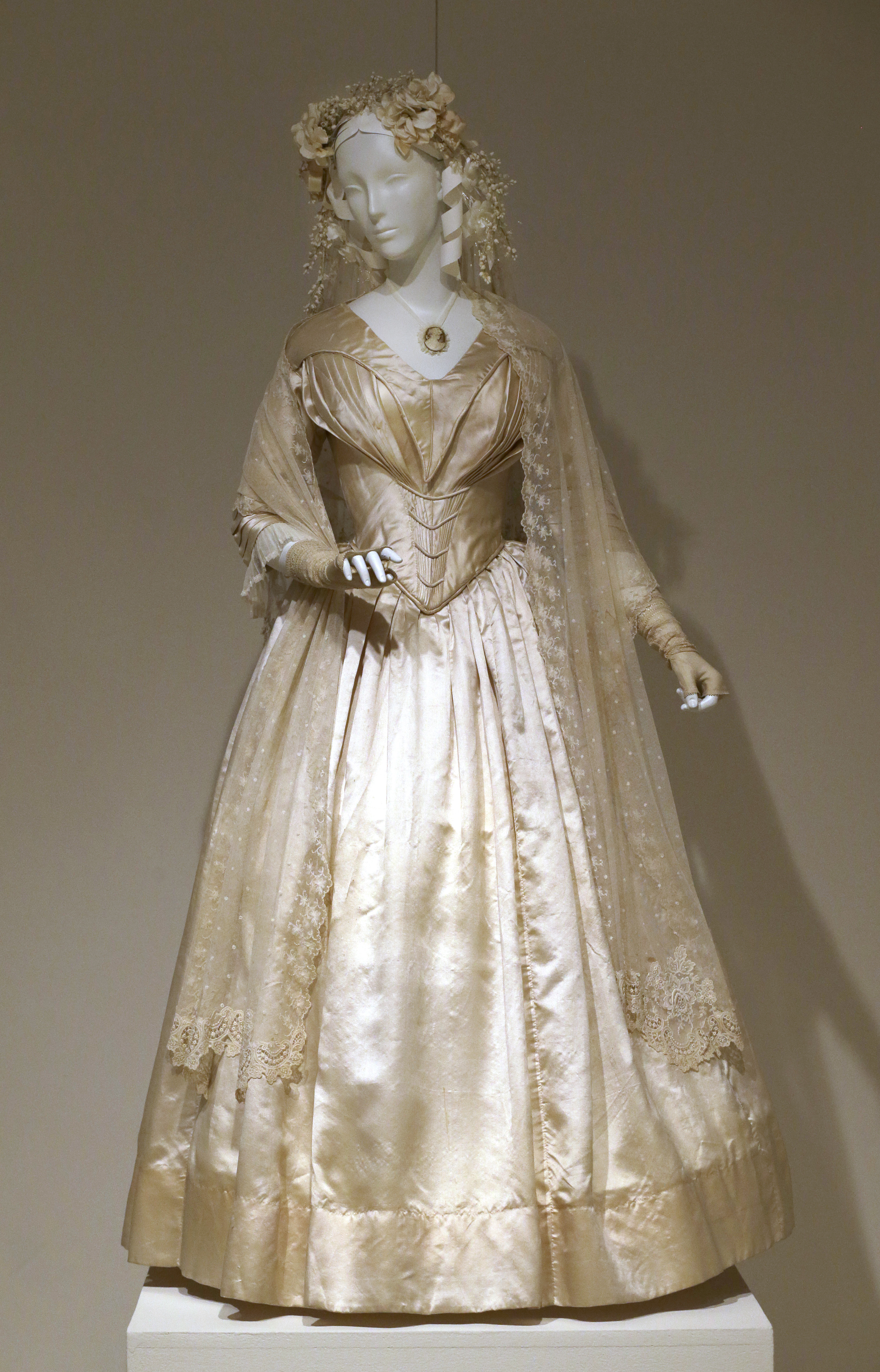 In this photo taken on Tuesday, July 1, 2014,  a wedding dress made in 1844 is displayed at the "American Brides: Inspiration and Ingenuity," exhibition in Denton, Texas. (AP)