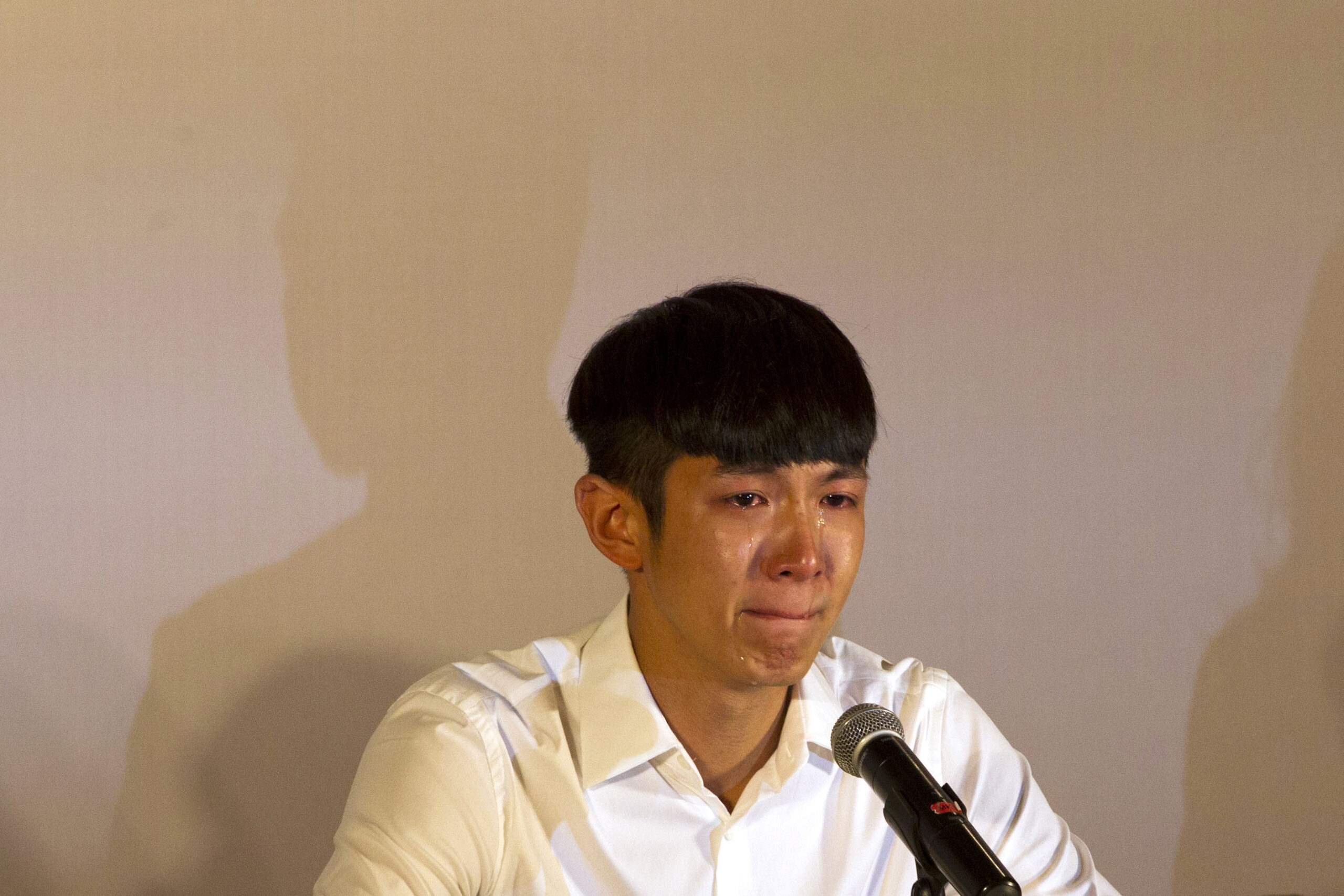 Kai Ko cries during a press conference held after his release from detention in Beijing, China, Friday, Aug. 29, 2014. Ko, a Taiwanese actor arrested on drug charges along with the son of Hong Kong film star Jackie Chan was released Friday after two weeks in detention, amid a broad anti-drug crackdown in China's capital that has ensnared several celebrities. (AP Photo/Peng Peng) (Peng Peng)