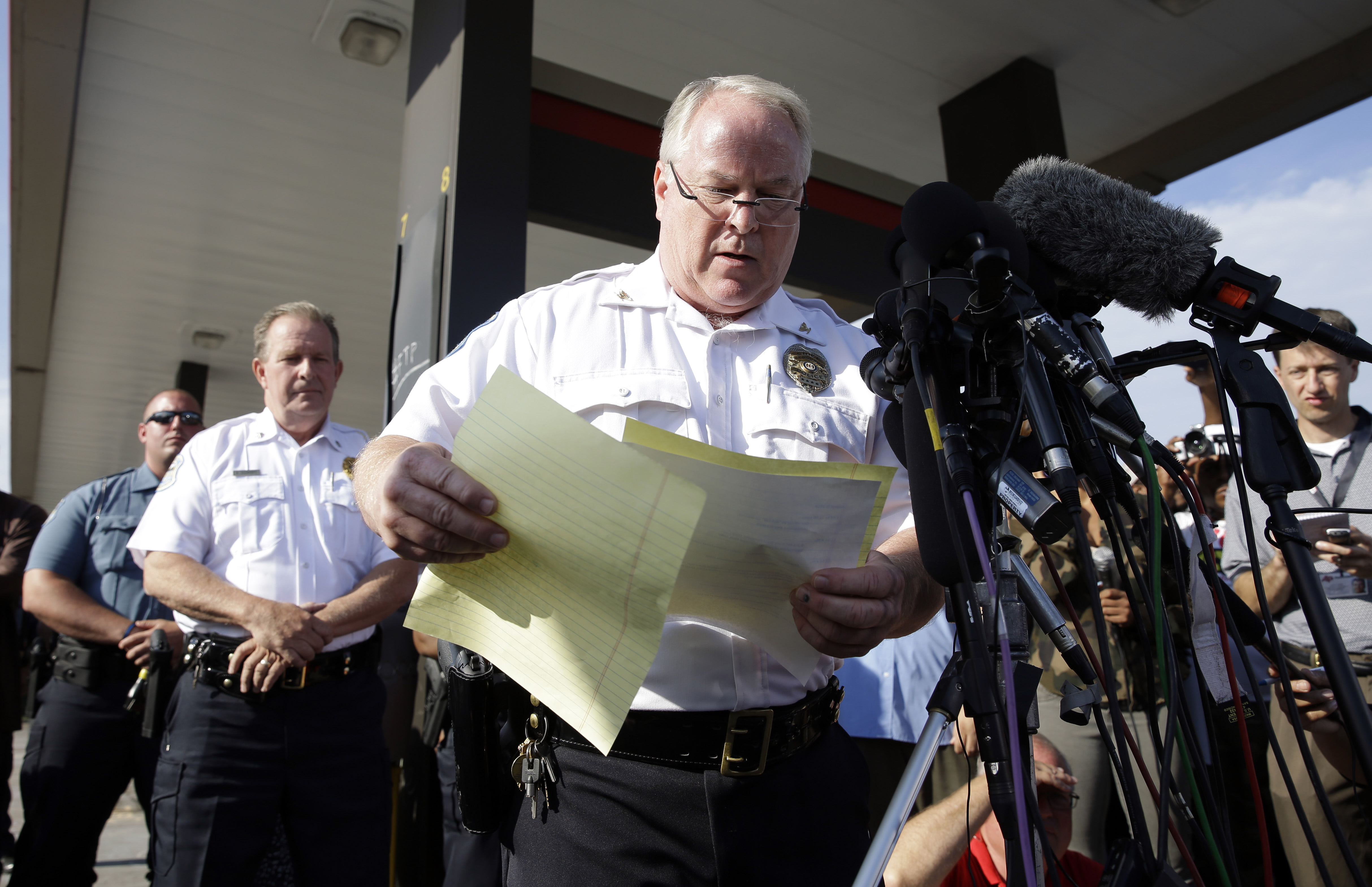 Ferguson Police Chief Thomas Jackson releases the name of the the officer accused of fatally shooting Michael Brown,  an unarmed black teenager,  Friday, Aug. 15, 2014, in Ferguson, Mo. Jackson announced that the officer's name is Darren Wilson. (AP/Jeff Roberson)