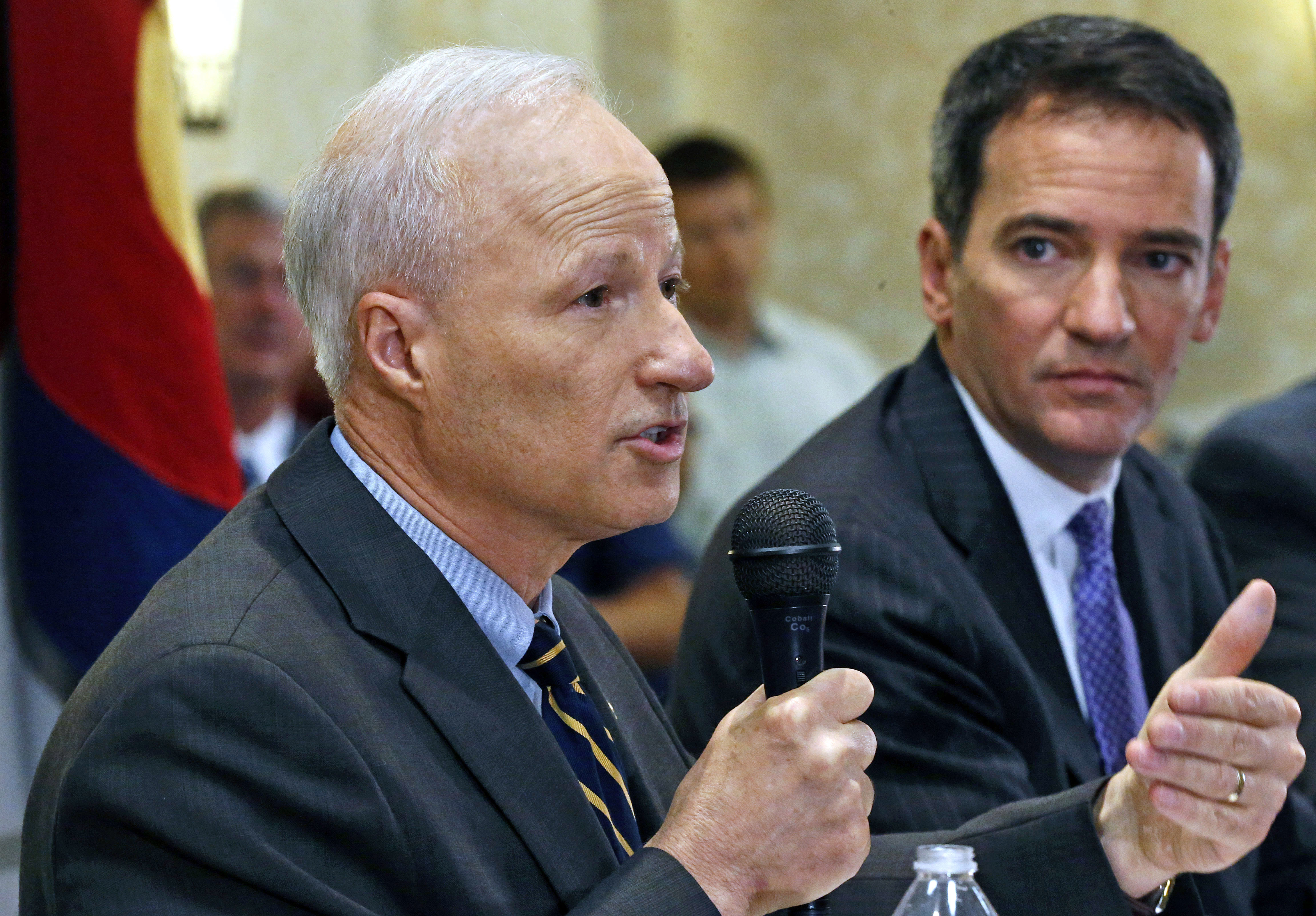 U.S. Rep. Mike Coffman, R-Colo., left, and Democratic challenger Andrew Romanoff face off in their first debate in Highlands Ranch, Colo., Thursday Aug. 14, 2014. The race is expected to be one of the closest in the country. (AP Photo/Brennan Linsley) (AP)