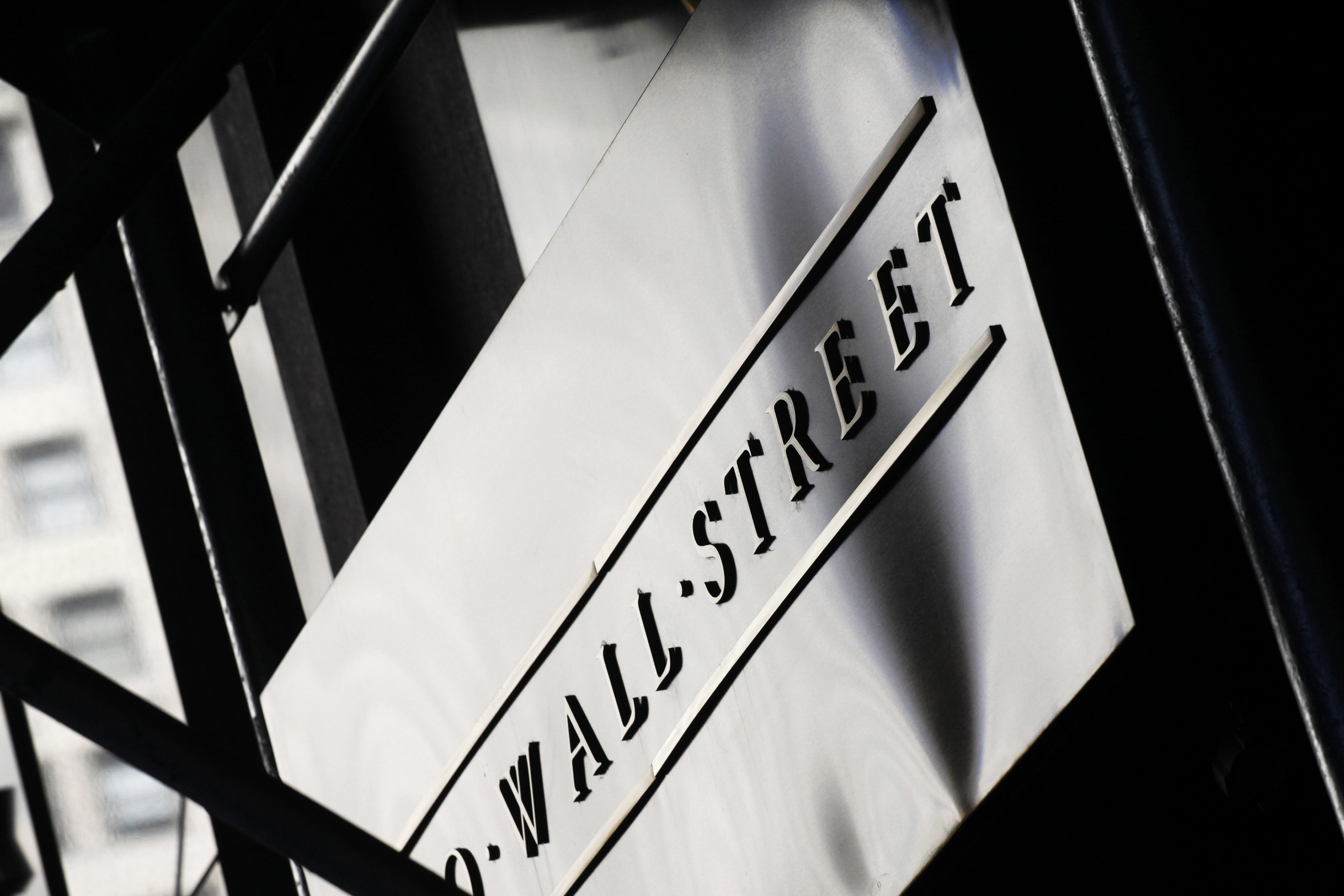 FILE - This July 15, 2013 file photo shows a sign for Wall Street outside the New York Stock Exchange, in New York. European and Asian stock markets were subdued Friday, Aug. 29, 2014, after data showed Japan's economy is struggling to recover from a sales tax hike and that inflation in the eurozone slipped again, a sign the recovery remains weak. (AP Photo/Mark Lennihan, File) (AP)