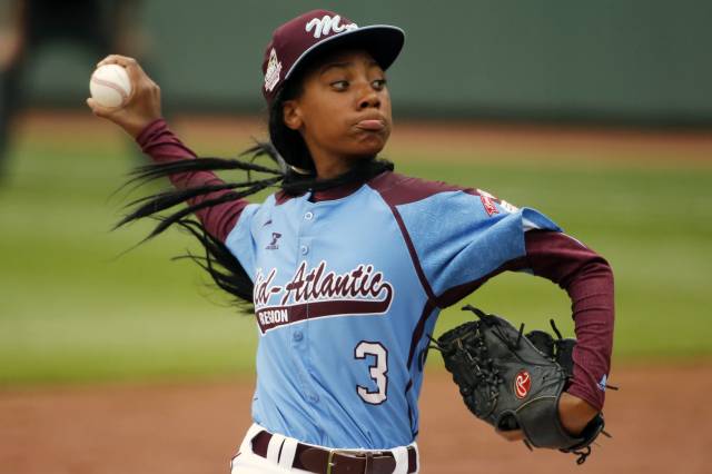 Pennsylvania's  Mo'ne Davis delivers in the fifth inning against Tennessee during a baseball game in United States pool play at the Little League World Series tournament in South Williamsport, Pa., Friday, Aug. 15, 2014. Pennsylvania won 4-0 with Davis pitching a complete game two-hit shutout. AP Photo/Gene J. Puskar) (AP)