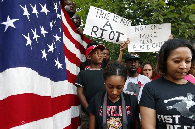 Protesters at Meridian Hill Park, also known as Malcom X Park, Aug. 14, 2014 in Washington, to protest the fatal shooting of Michael Brown by police in Ferguson, Mo. (AP/Alex Brandon)