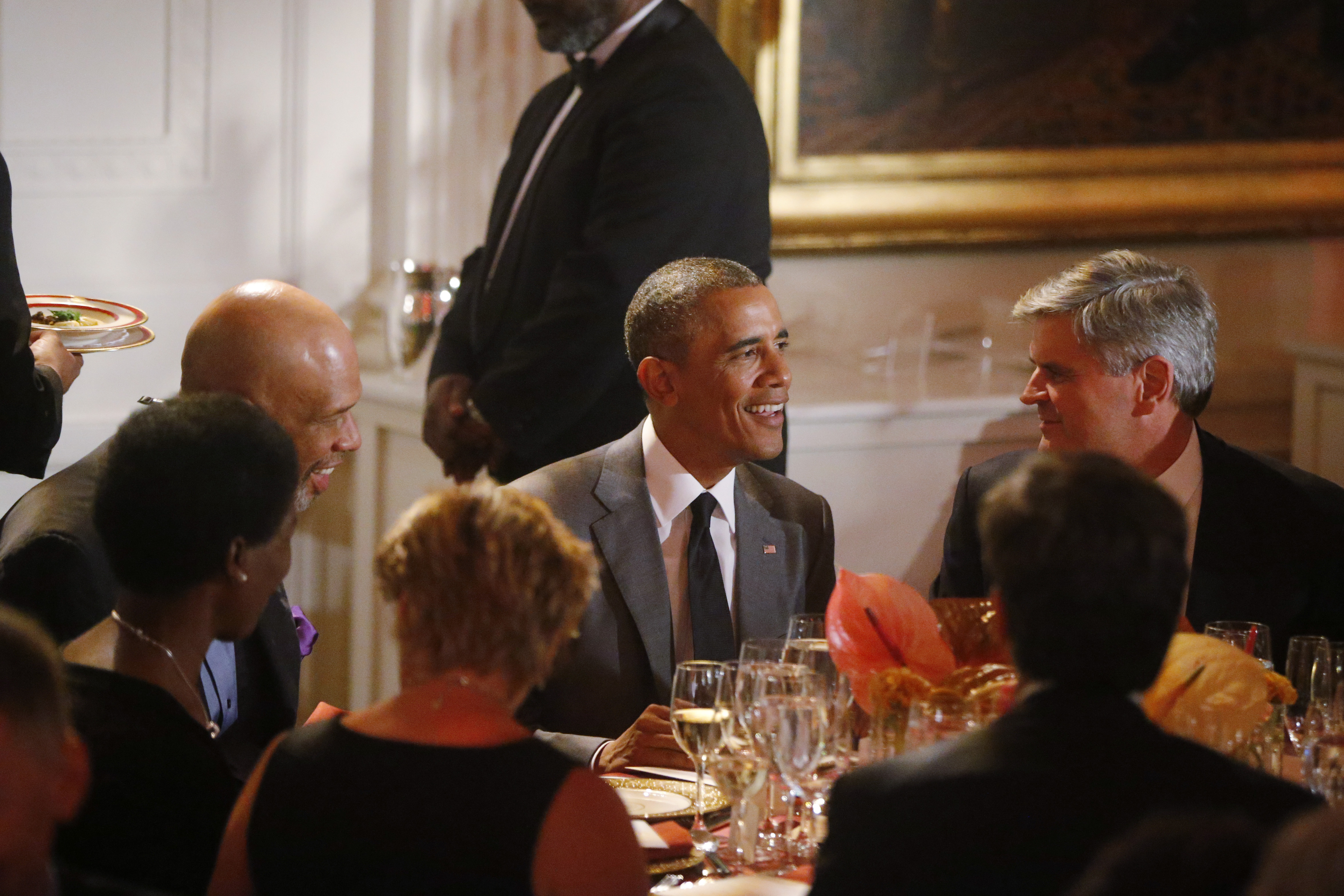 President Barack Obama is seated with Kareem Abdul-Jabbar, retired American professional basketball player, and businessman Steve Case at a dinner for the Special Olympics in the East Room at the White House in Washington, Thursday, July 31, 2014. (AP Photo/Charles Dharapak) (AP)
