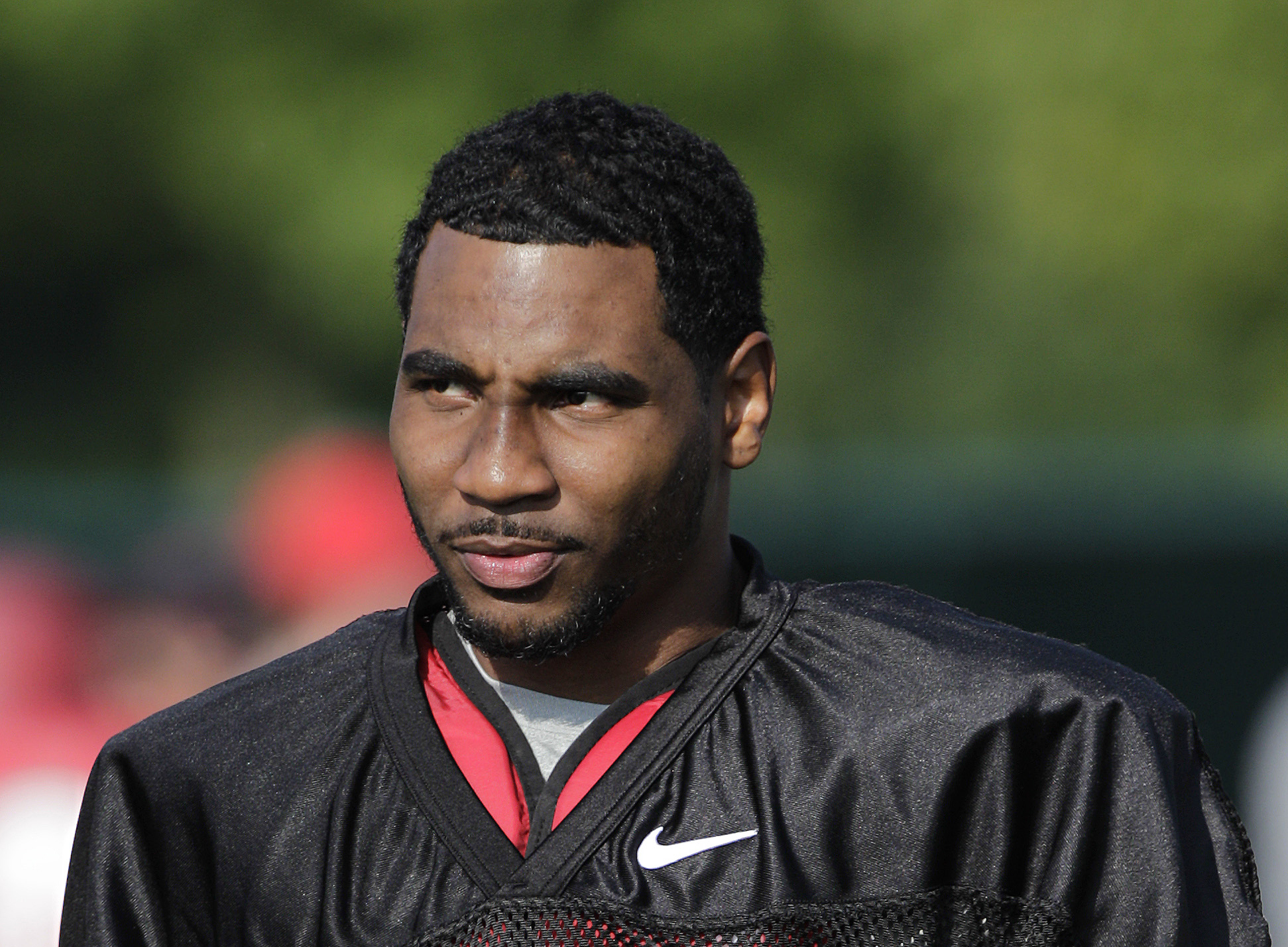 FILE - In this Aug. 9, 2014, file photo, Ohio State quarterback Braxton Miller watches teammates warm up during an NCAA college football practice in Columbus, Ohio. Miller, among the top contenders for the Heisman Trophy, reportedly reinjured his throwing shoulder during practice. The report about the two-time Big Ten offensive player of the year comes with just more than two weeks before the No. 5 Buckeyes open the season. (AP Photo/Jay LaPrete, File) (AP)