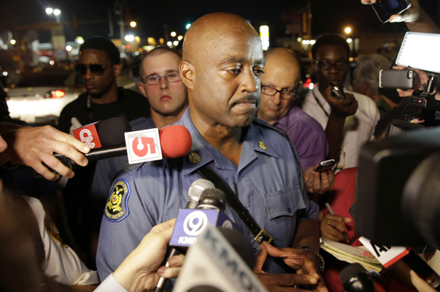 Capt. Ron Johnson of the Missouri Highway Patrol is surrounded by media after meeting with protesters Monday, Aug. 18, 2014, in Ferguson, Mo. (AP/Jeff Roberson)