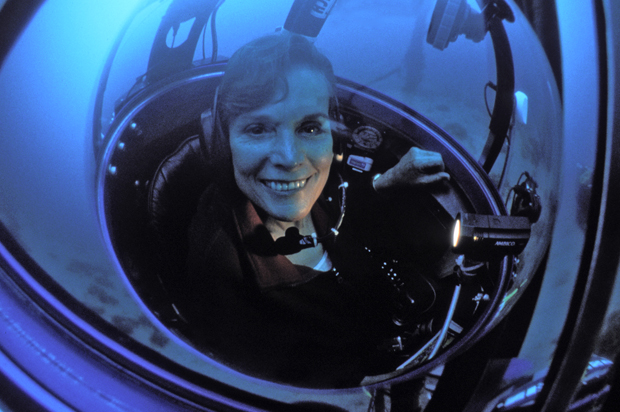 Sylvia Earle sits on a tiny one-person submersible called the Deep Worker. (Kip Evans)