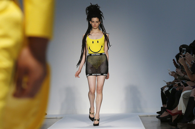 Models present creations from Moschino in London, June 16, 2014. (Reuters/Suzanne Plunkett)