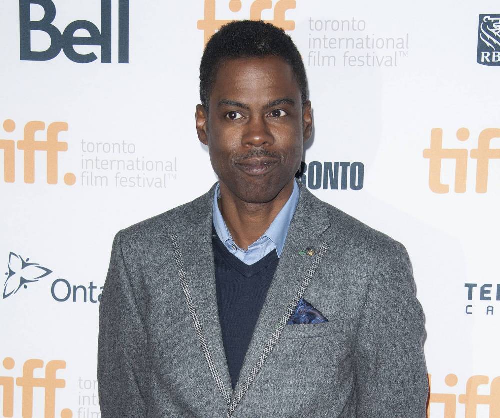 Chris Rock poses at the "Top Five" premiere at the Princess of Wales Theatre during the 2014 Toronto International Film Festival on Saturday, Sept. 6, 2014, in Toronto. (Photo by Arthur Mola/Invision/AP)