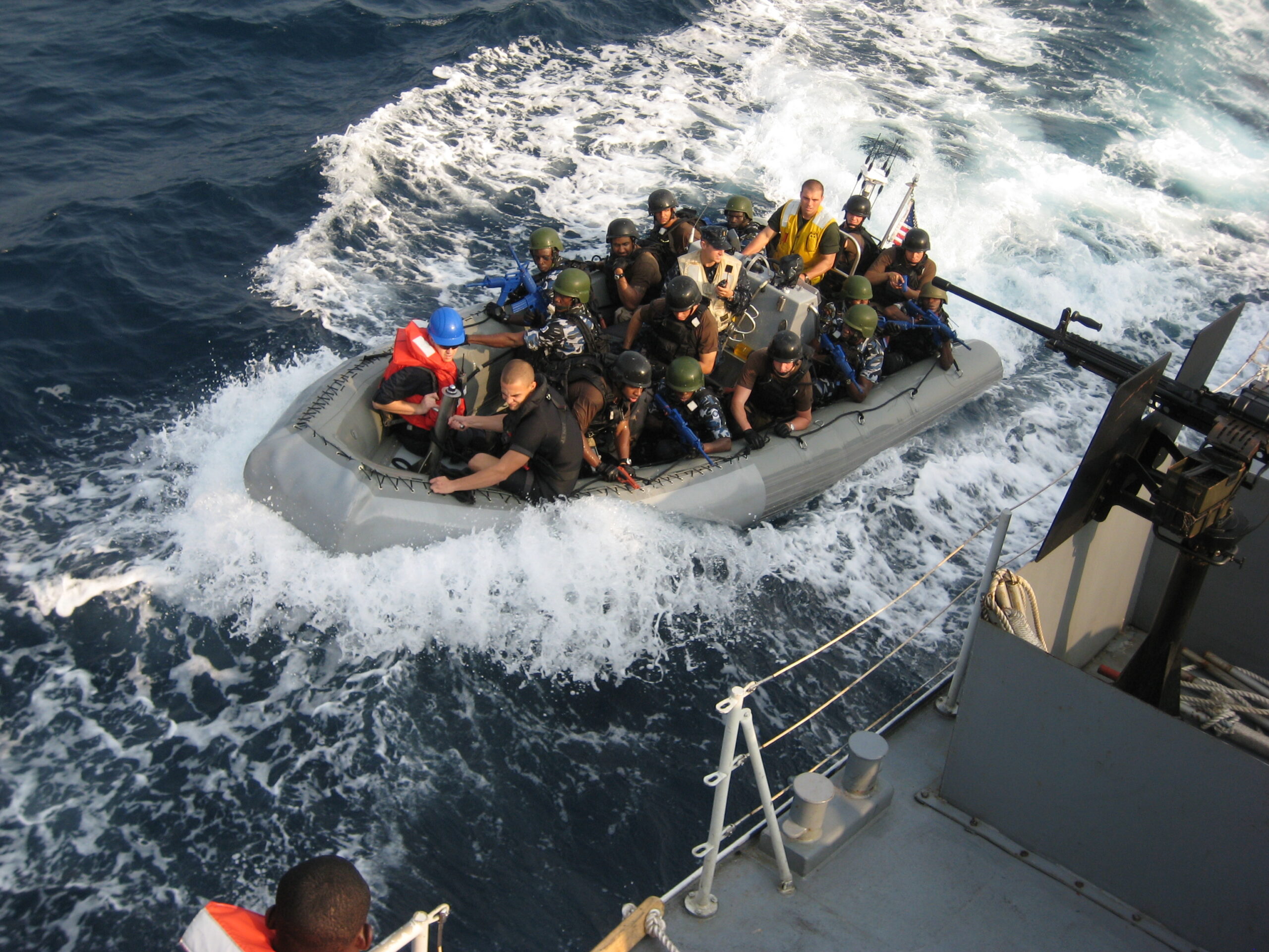 A crew of U.S. sailors and Nigerian special forces fighters prepares to board the NNS Burutu for a training exercise off the Nigerian coast. (AP/Jon Gambrell)