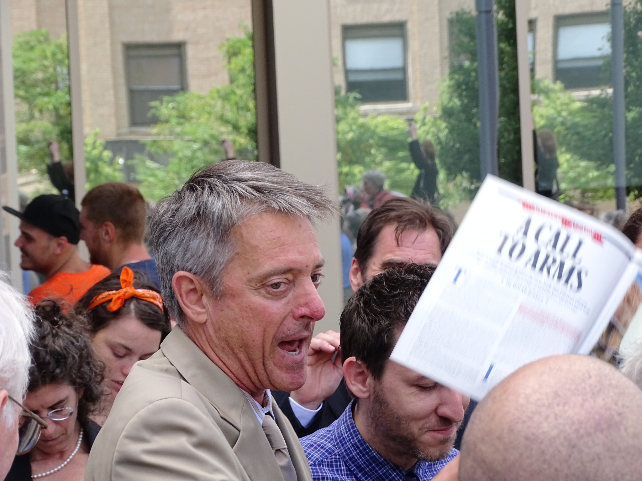 D.A. Samuel Sutter holds up Bill McKibbon's Rolling Stone article (Peter Bowden)