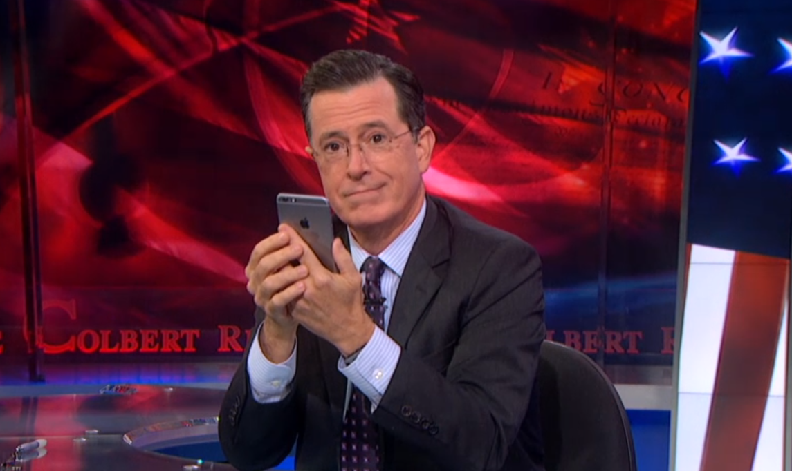 Colbert with iPhone 6 Plus (svreenshot/"The Colbert Report")