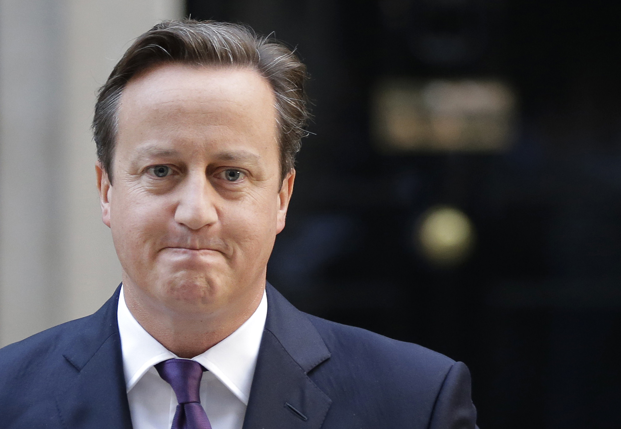 British Prime Minister David Cameron leaves after giving a statement to the media about Scotland's referendum results, outside his official residence at 10 Downing Street in central London,  Friday, Sept. 19, 2014. Scottish voters have rejected independence, deciding to remain part of the United Kingdom after a historic referendum that shook the country to its core. The decision prevented a rupture of a 307-year union with England, bringing a huge sigh of relief to the British political establishment. (AP Photo/Lefteris Pitarakis) (AP)