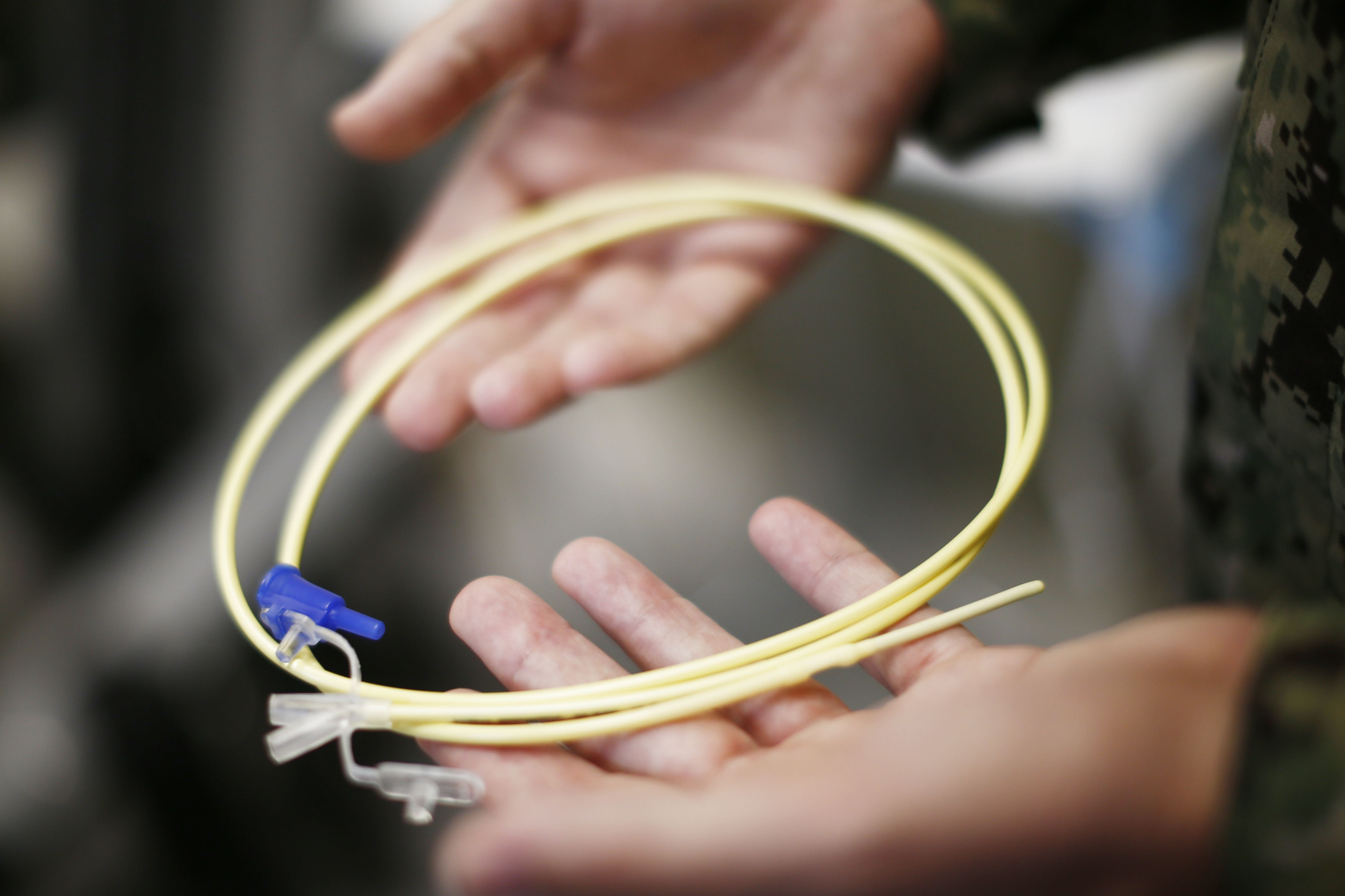 In this Nov. 20, 2013, file photo, reviewed by the U.S. military, U.S. Navy medical personnel displays an enteral feeding tube, used for force-feeding detainees, during a tour of the detainee hospital at Guantanamo Bay Naval Base, Cuba. Guantanamo prisoner, 43-year-old Abu Wael Dhiab has been engaged in a tense struggle with guards in recent months during 2014, according to documents filed in federal court in Washington, where Dhiab, who has been fed by through a nasal tube to prevent starvation, is challenging some of the tactics used by the military to deal with prisoners on hunger strike. (AP/Charles Dharapak)