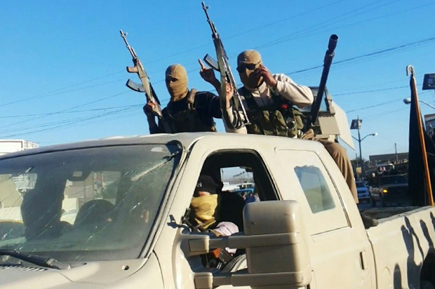 Militants from the Islamic State of Iraq and the Levant (ISIL), in Fallujah, June 30, 2014 (AP)