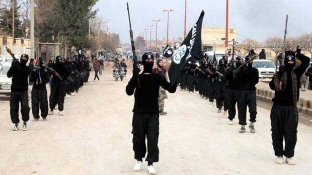 The Islamic State group march in Raqqa, Syria (AP Photo/Militant Website)