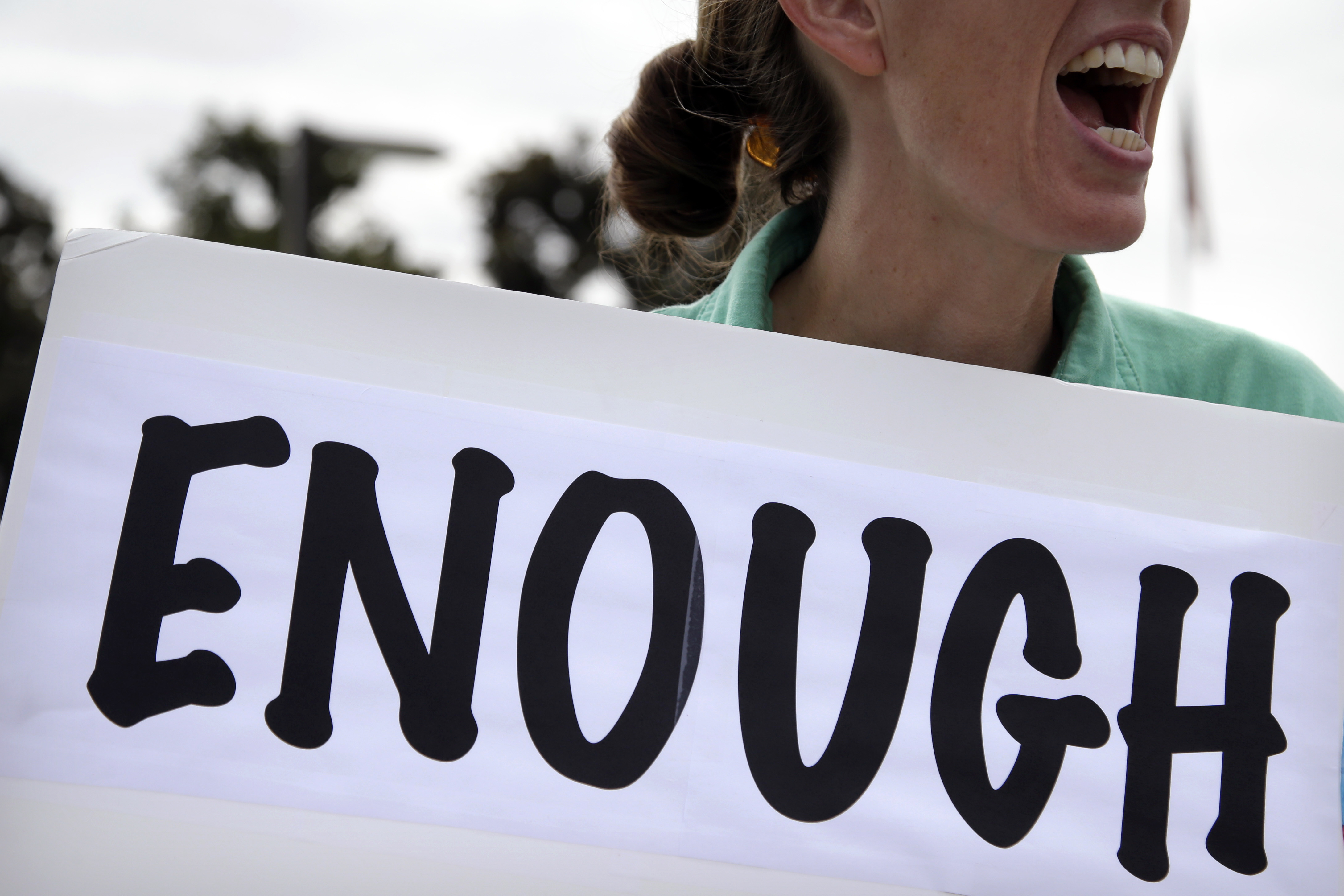 This Oct. 2, 2013, file photo shows Vicki Maturo, of Culver City, Calif., as she protests against the government shutdown outside the federal building in Los Angeles. The election of 2014 is an election of contradictions. A surly electorate holds President Barack Obama in low regard and gives Congress even worse marks, yet for all their anger, a historic few are motivated enough to vote and those that do are poised to "keep the bums in." (AP Photo/Jae C. Hong, File) (AP)